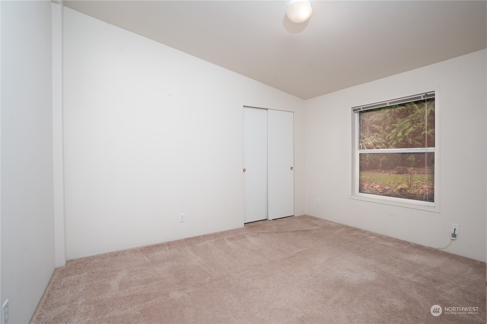 17908 Erickson Road Southwest Longbranch, WA 98351 - Photo 14 of 30 an empty room with windows