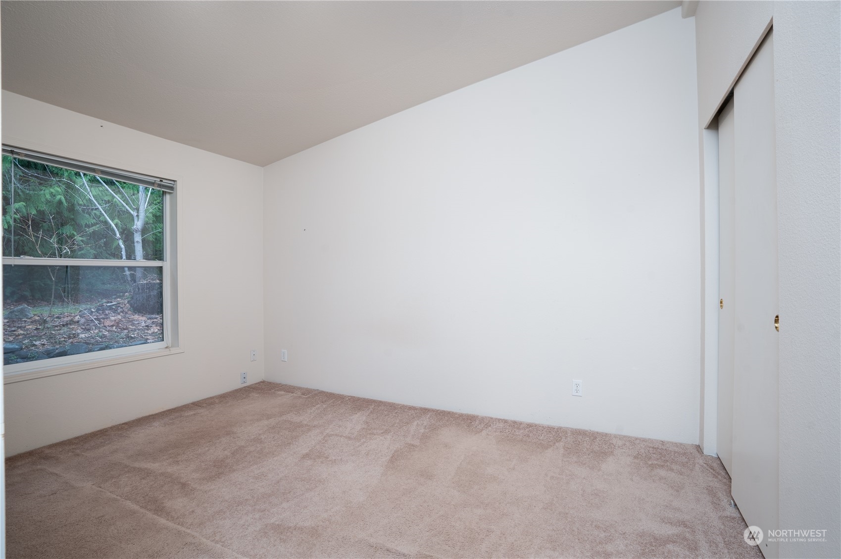 17908 Erickson Road Southwest Longbranch, WA 98351 - Photo 15 of 30 an empty room with a window
