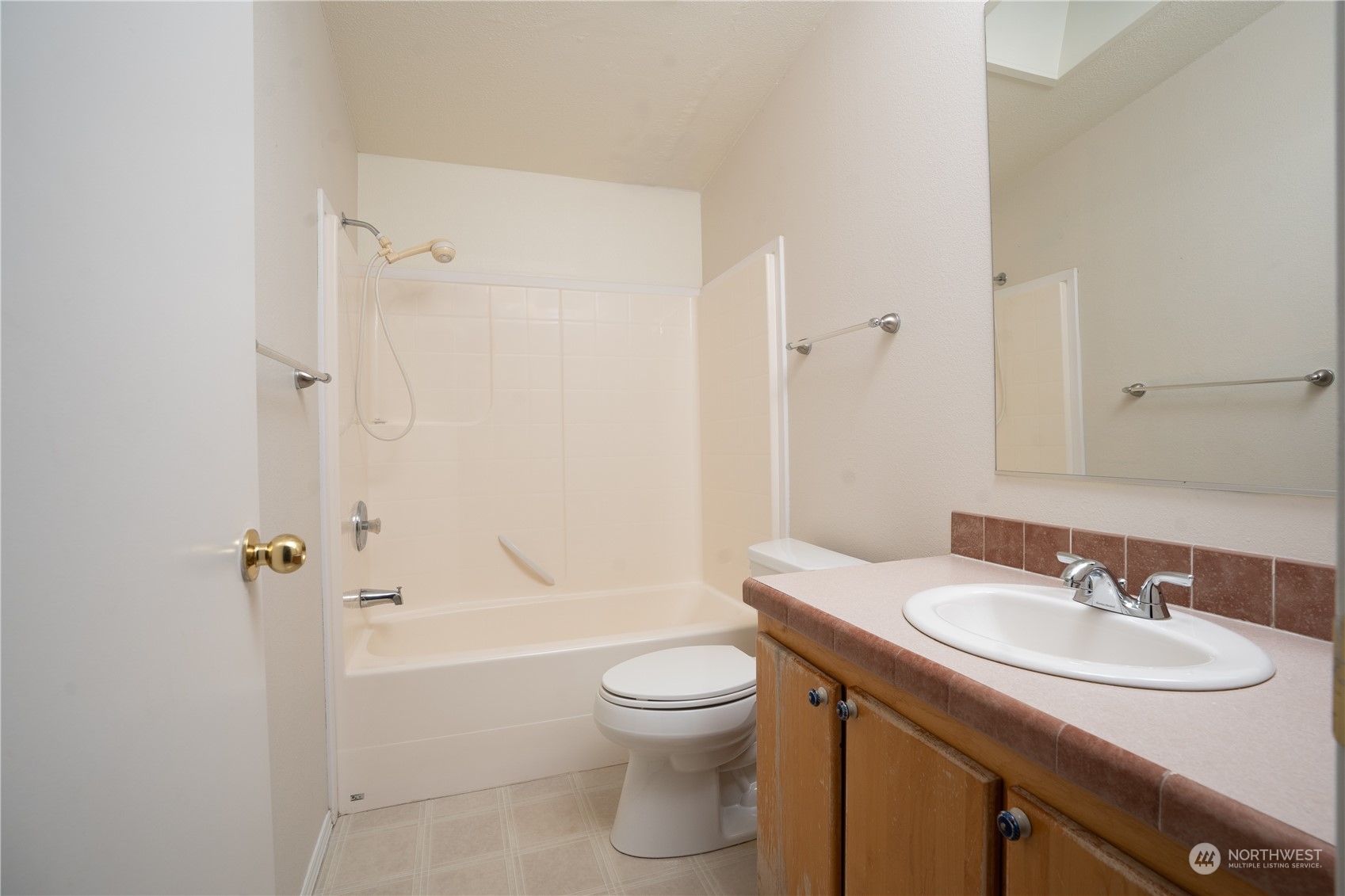 17908 Erickson Road Southwest Longbranch, WA 98351 - Photo 16 of 30 a bathroom with a sink toilet and shower