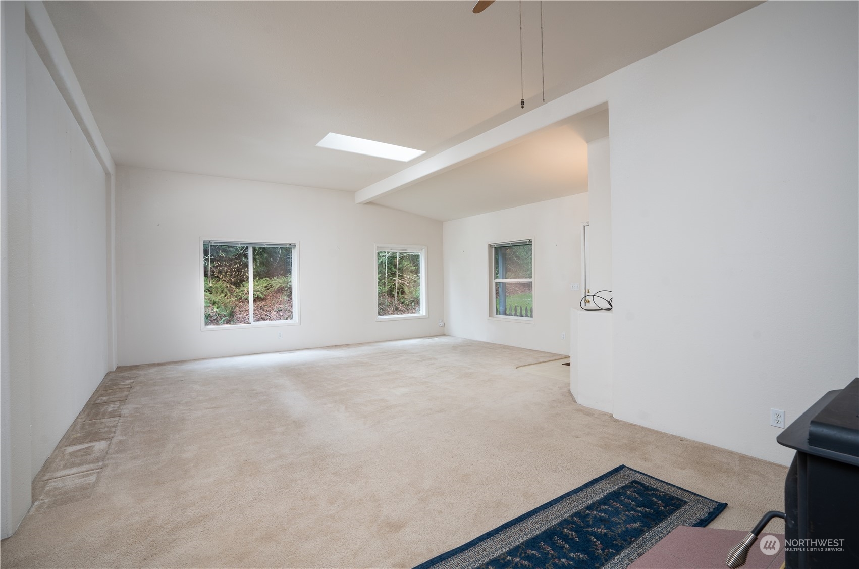 17908 Erickson Road Southwest Longbranch, WA 98351 - Photo 20 of 30 an empty room with windows