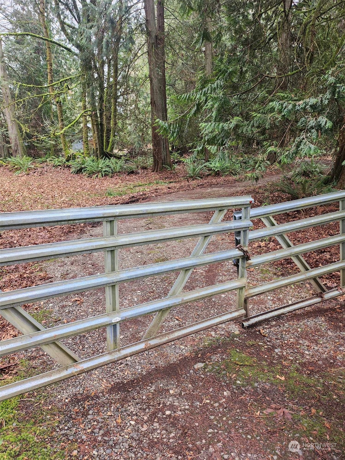 17908 Erickson Road Southwest Longbranch, WA 98351 - Photo 23 of 30 a view of a yard with wooden fence