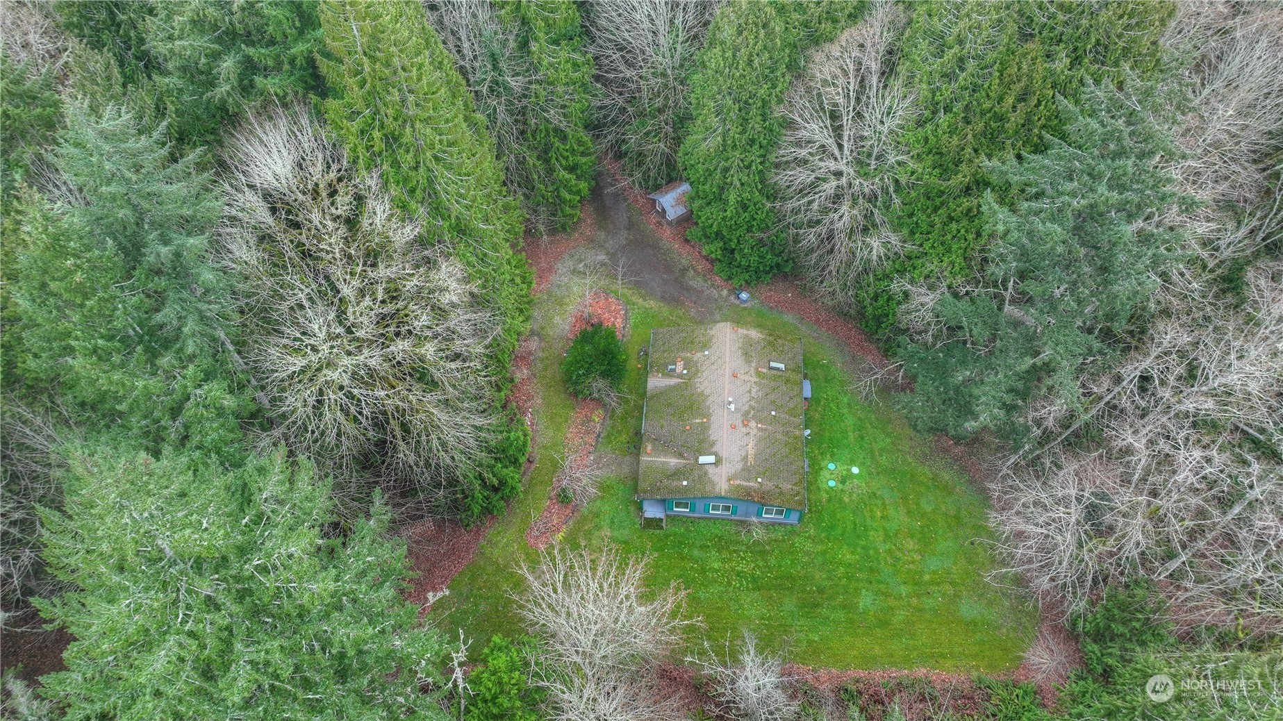 17908 Erickson Road Southwest Longbranch, WA 98351 - Photo 28 of 30 a aerial view of a house with a yard and large trees