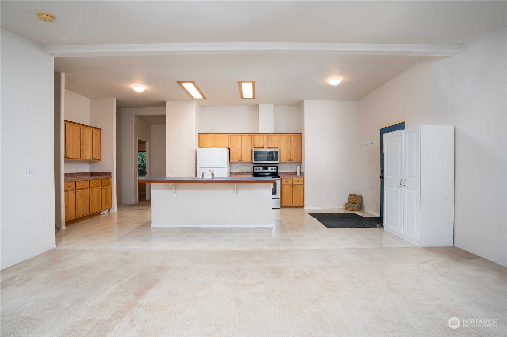 17908 Erickson Road Southwest Longbranch, WA 98351 - Photo 6 of 30 a view of kitchen with kitchen island a sink stainless steel appliances and cabinets