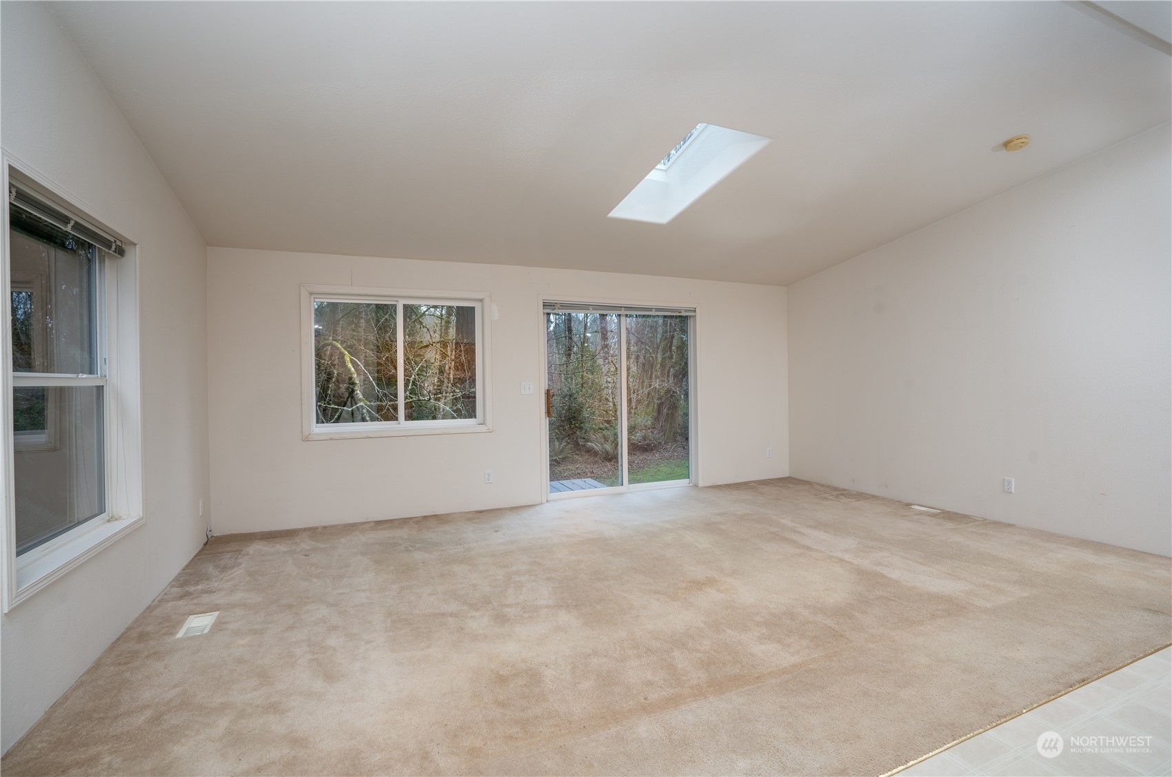 17908 Erickson Road Southwest Longbranch, WA 98351 - Photo 7 of 30 an empty room with windows