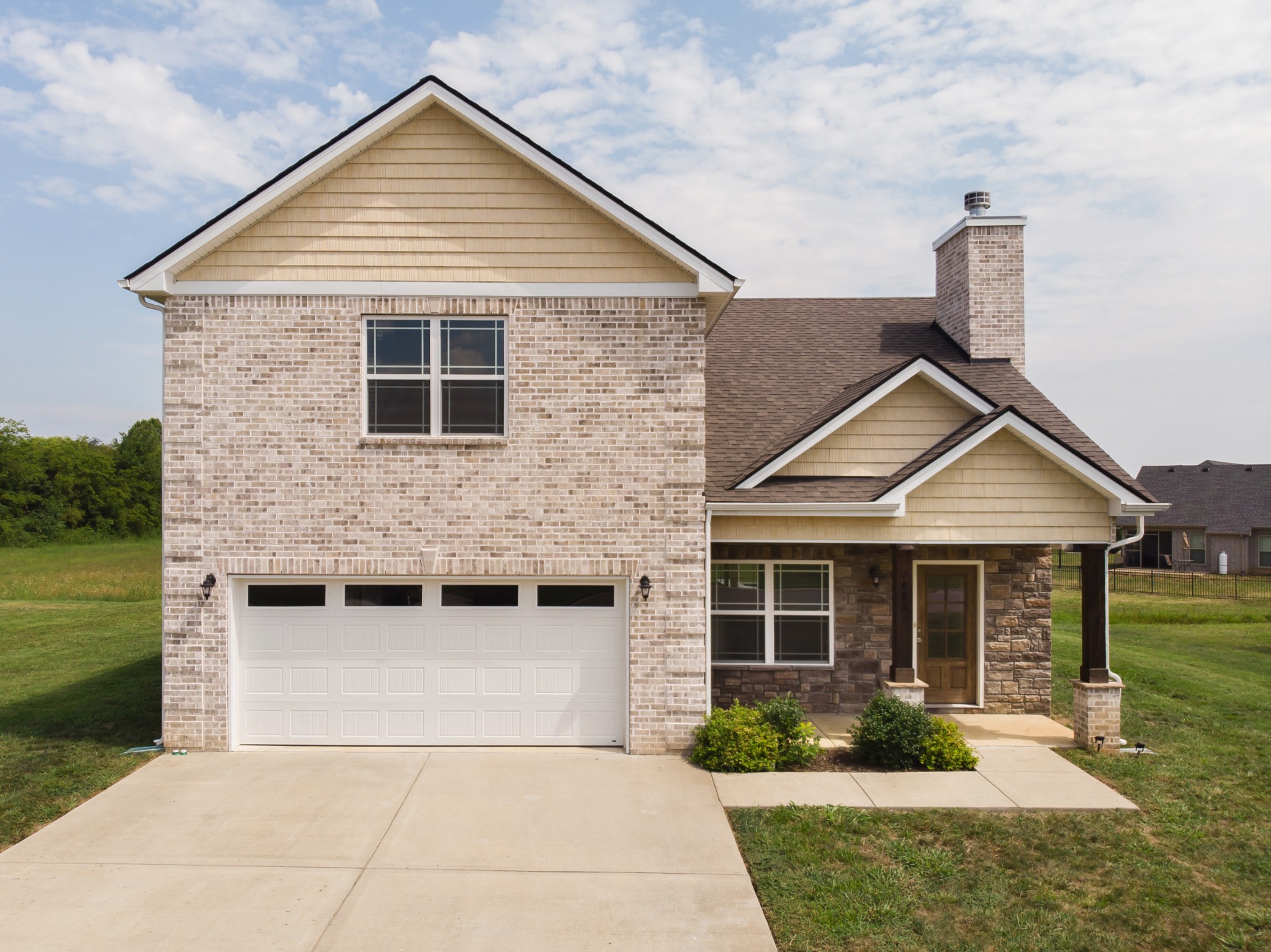 1426 Alamo Avenue Murfreesboro, TN 37129 - Photo 1 of 34 a front view of a house with garden