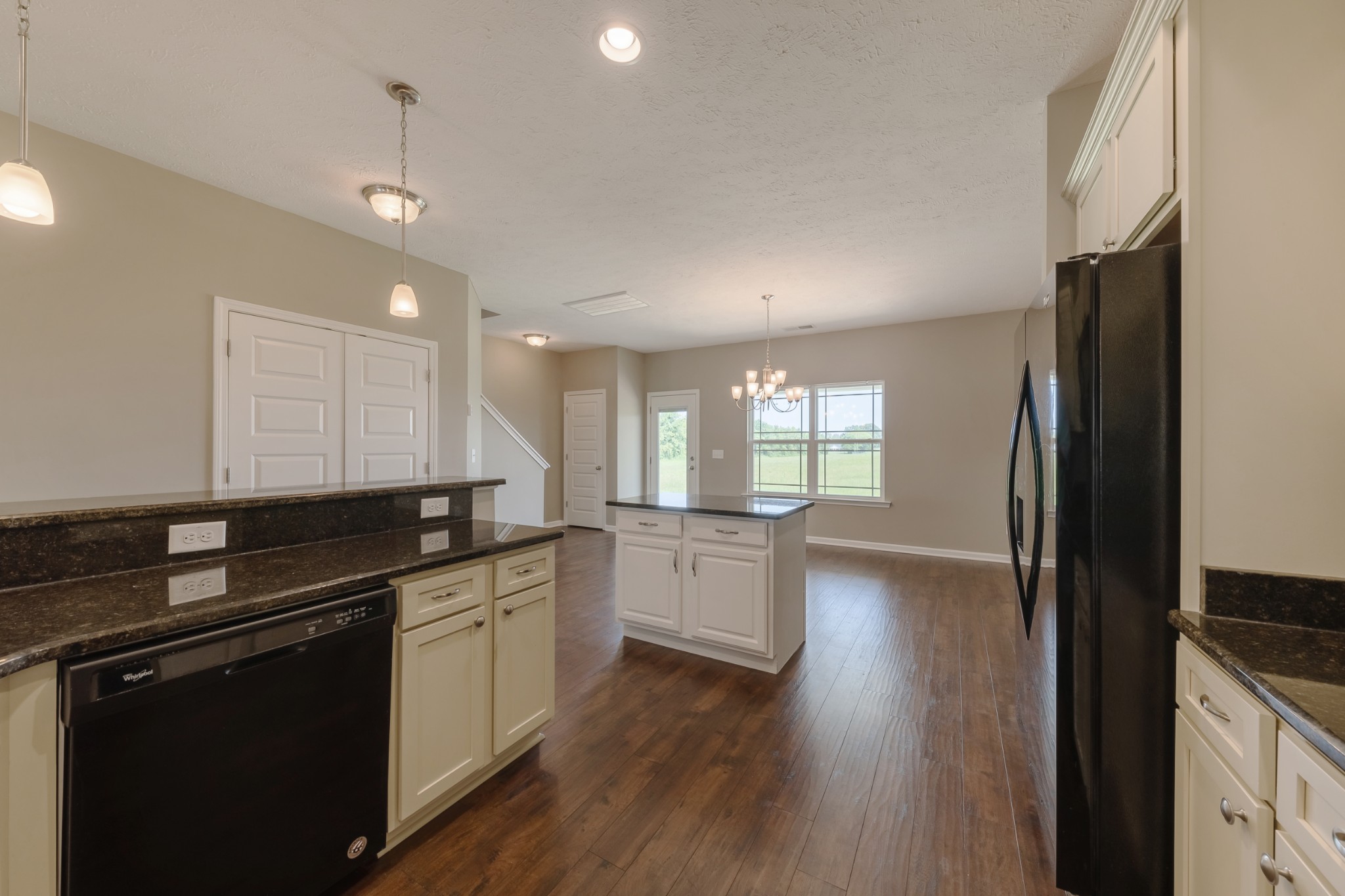 1426 Alamo Avenue Murfreesboro, TN 37129 - Photo 11 of 34 a kitchen with a sink a counter top space stainless steel appliances and cabinets