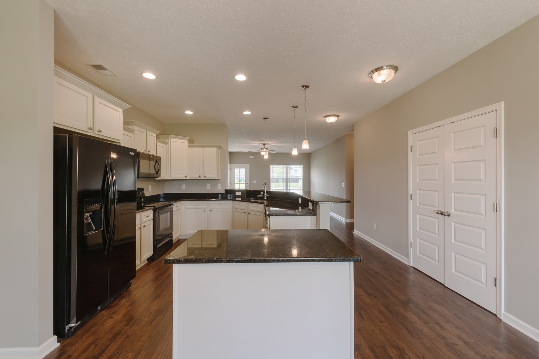 1426 Alamo Avenue Murfreesboro, TN 37129 - Photo 12 of 34 a large kitchen with a center island stainless steel appliances and a window