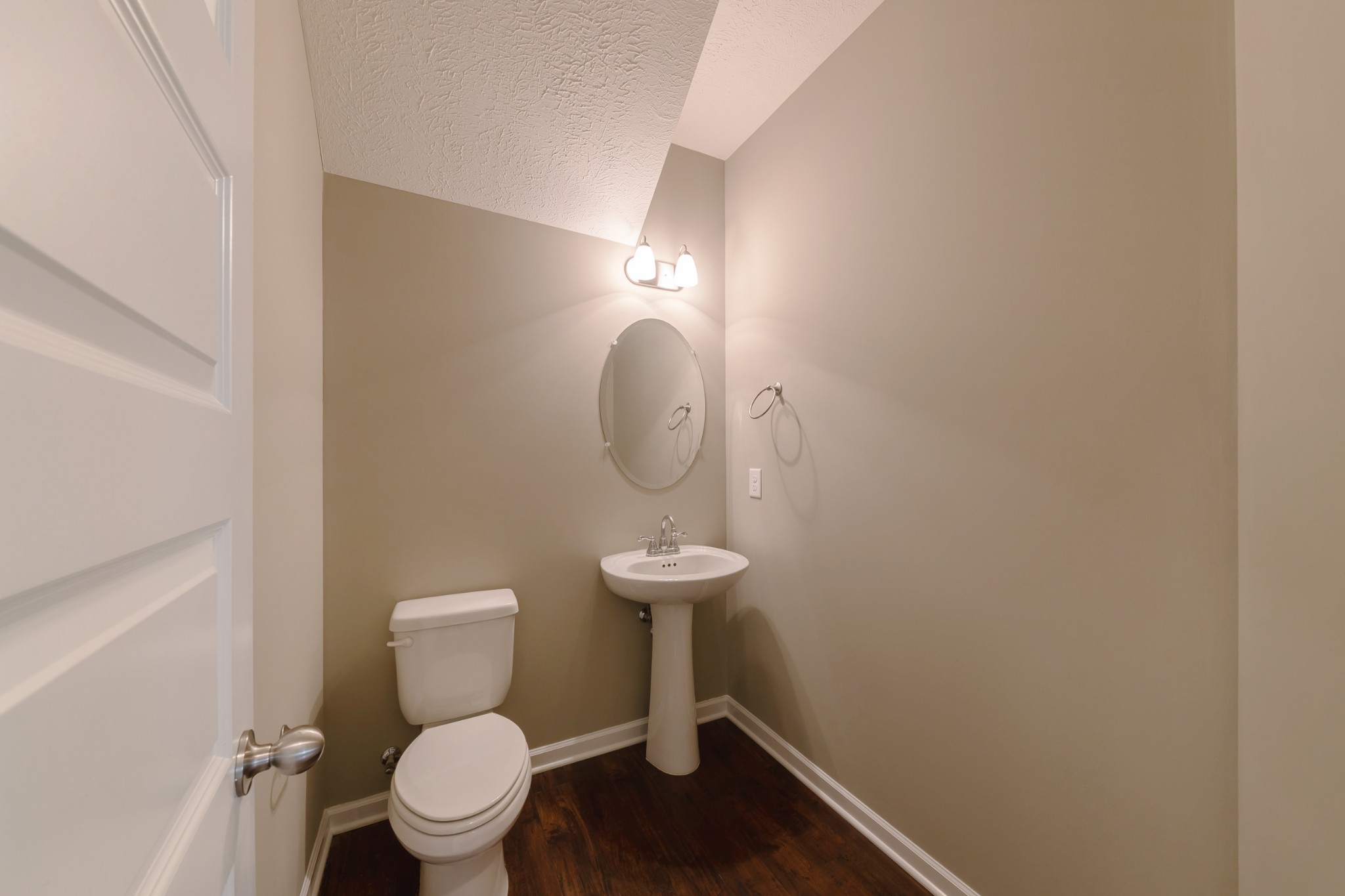 1426 Alamo Avenue Murfreesboro, TN 37129 - Photo 14 of 34 a bathroom with a toilet a sink and a mirror