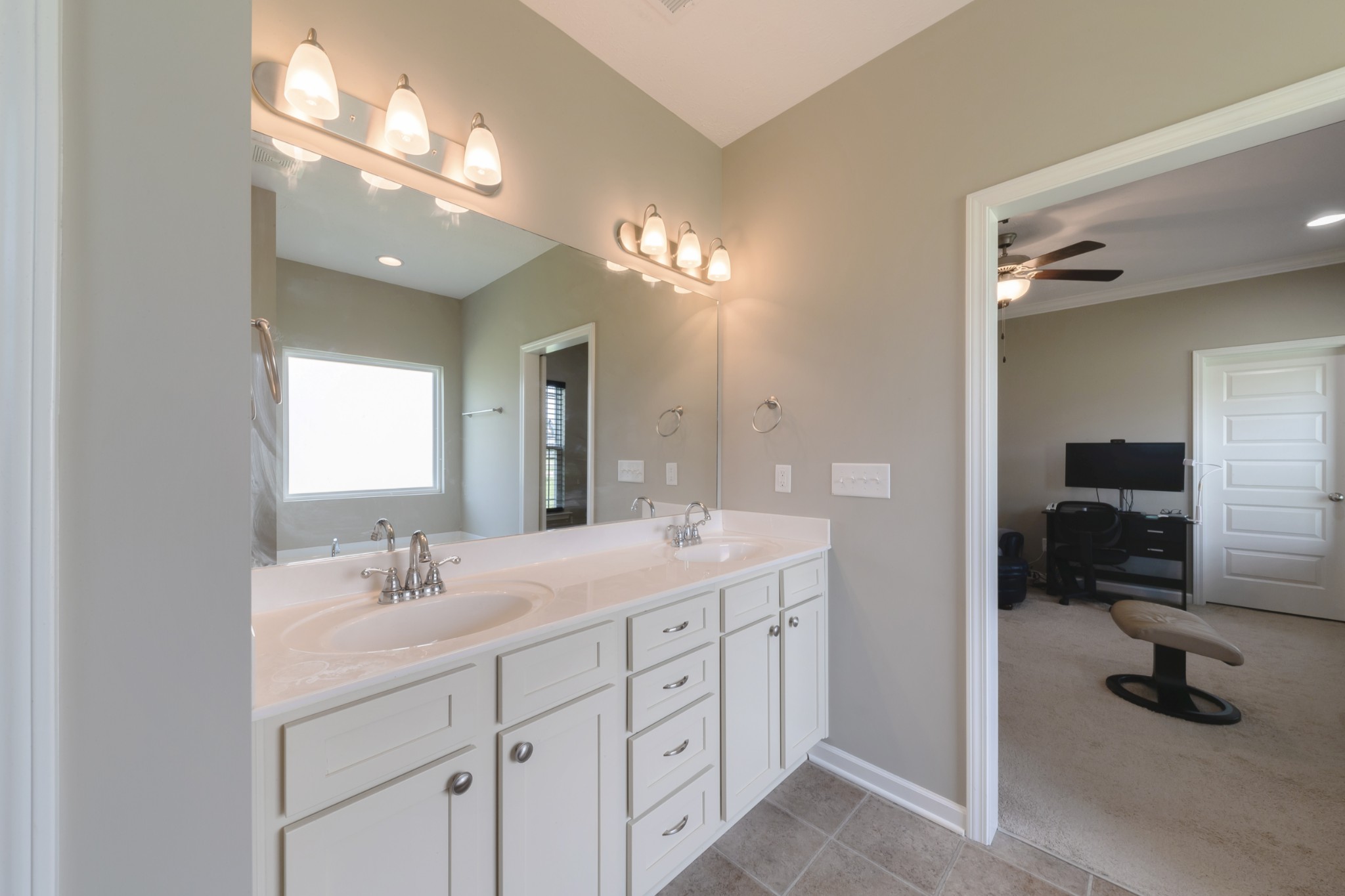 1426 Alamo Avenue Murfreesboro, TN 37129 - Photo 18 of 34 a en suite bathroom with double sink and a mirror