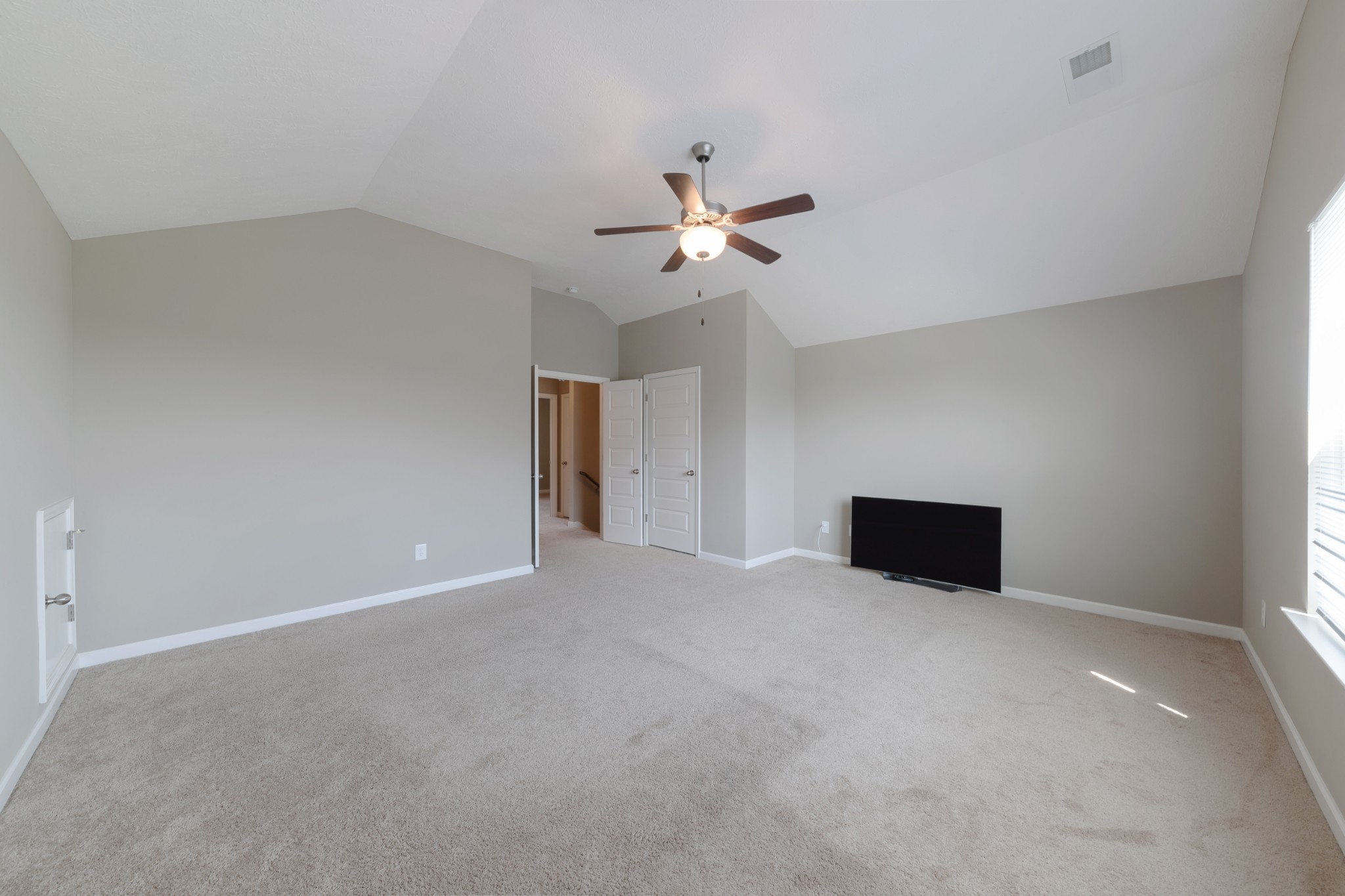 1426 Alamo Avenue Murfreesboro, TN 37129 - Photo 25 of 34 a view of an empty room with a ceiling fan