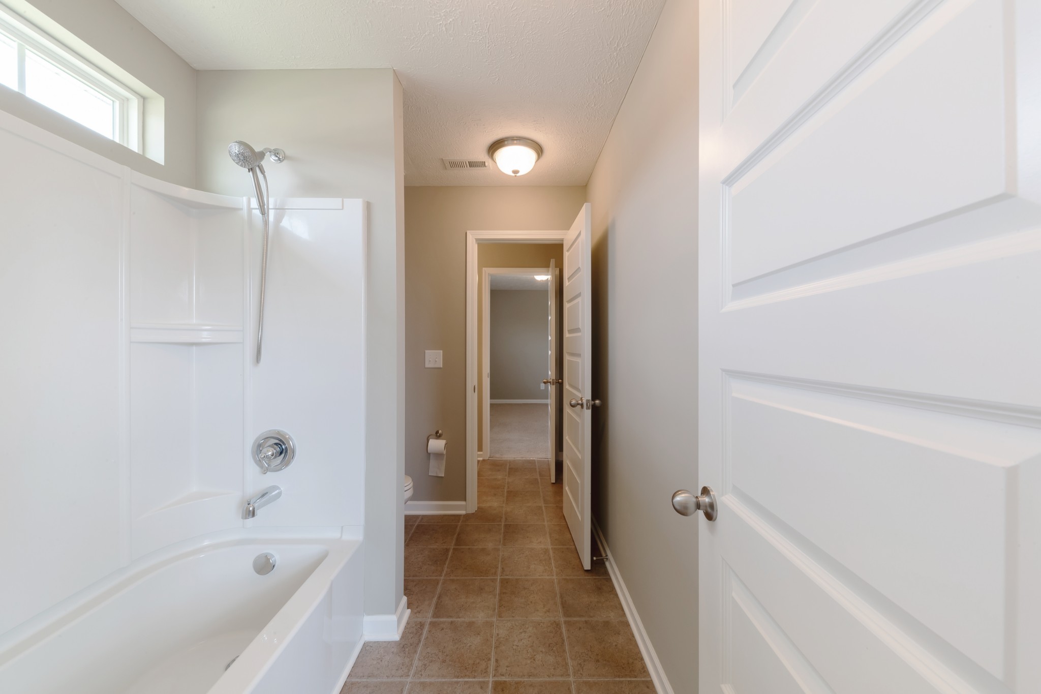 1426 Alamo Avenue Murfreesboro, TN 37129 - Photo 26 of 34 a bathroom with a bathtub and shower