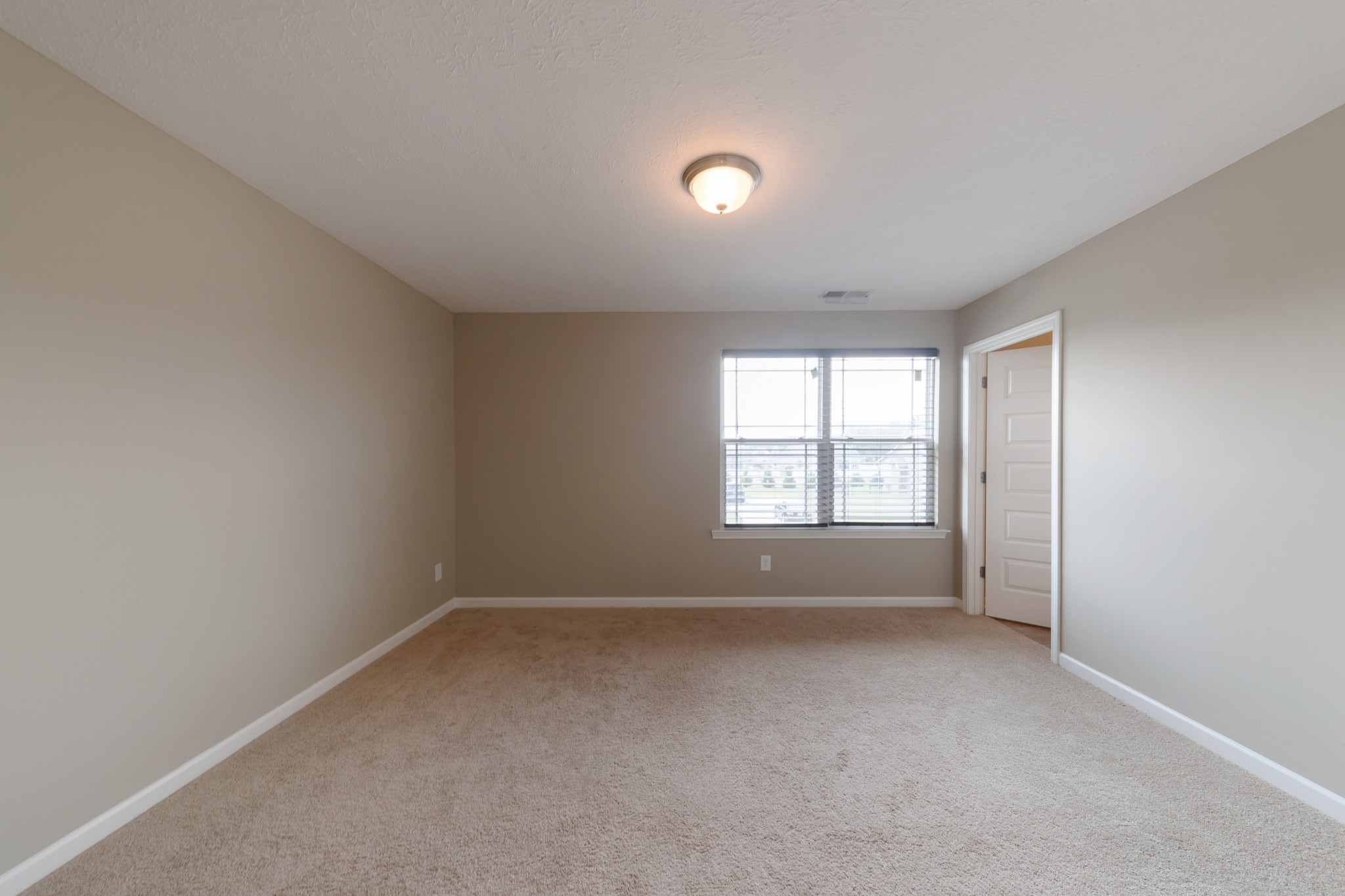 1426 Alamo Avenue Murfreesboro, TN 37129 - Photo 29 of 34 wooden floor and window in an empty room