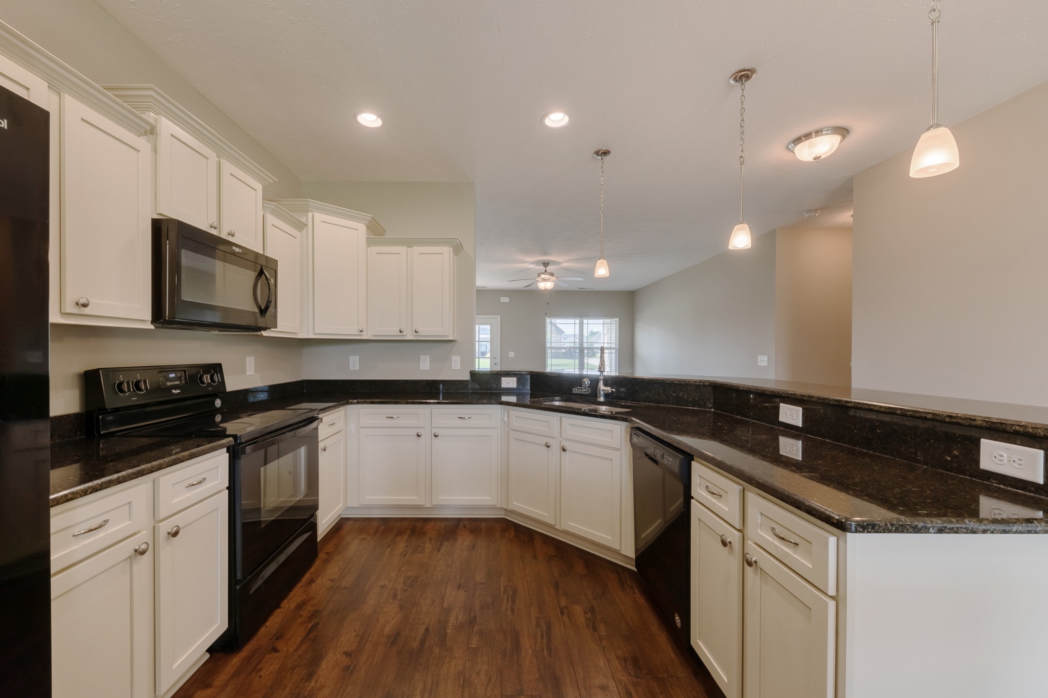 1426 Alamo Avenue Murfreesboro, TN 37129 - Photo 10 of 34 a kitchen with granite countertop white cabinets and white appliances