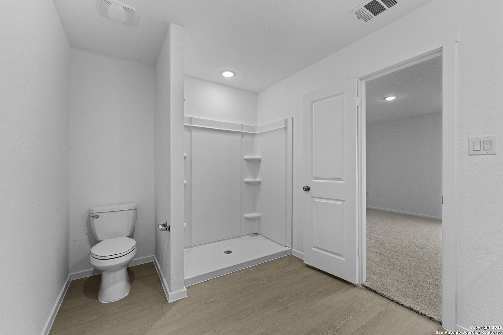 1834 Stonechat New Braunfels, TX 78130 - Photo 16 of 29 a spacious bathroom with a toilet and a shower