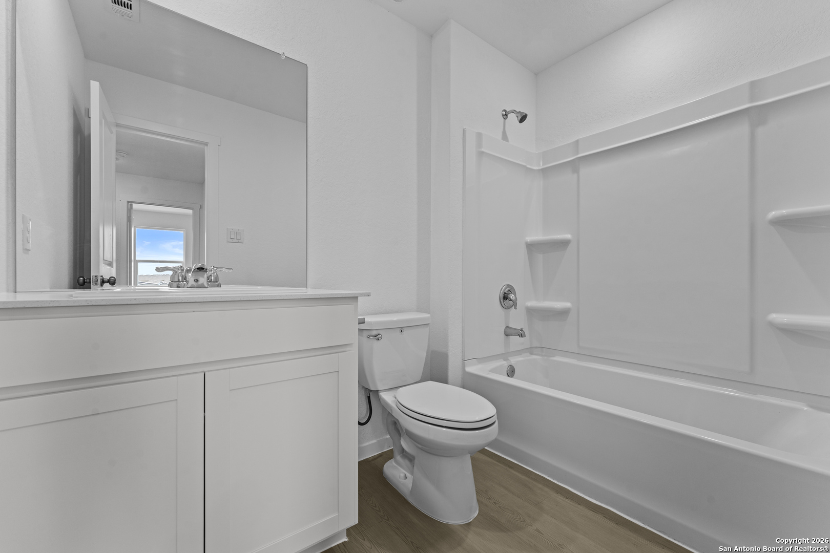 1834 Stonechat New Braunfels, TX 78130 - Photo 28 of 29 a bathroom with a sink toilet vanity and shower