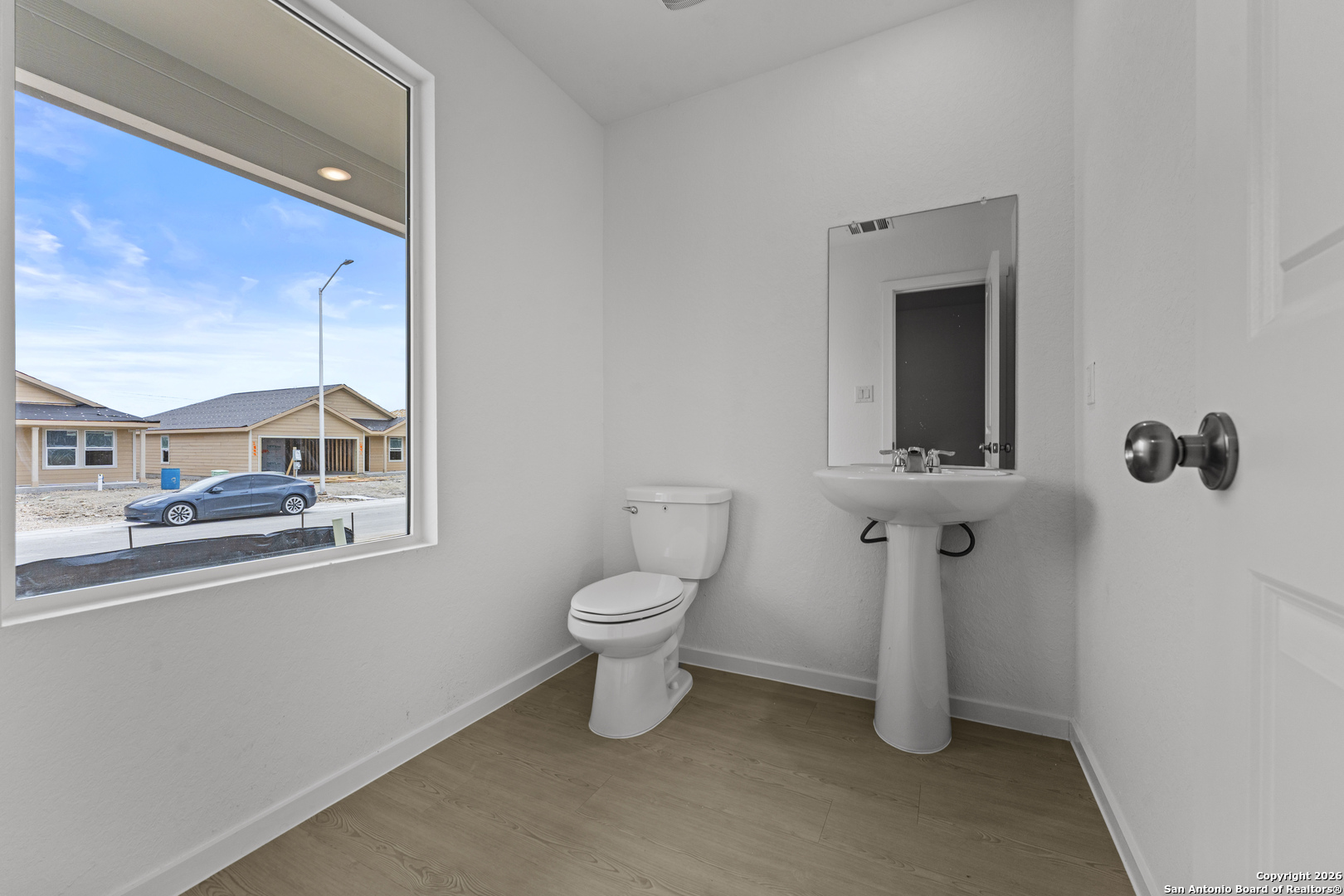 1834 Stonechat New Braunfels, TX 78130 - Photo 3 of 29 a bathroom with a toilet sink and mirror