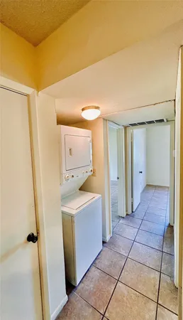 a view of a storage & utility room with a sink