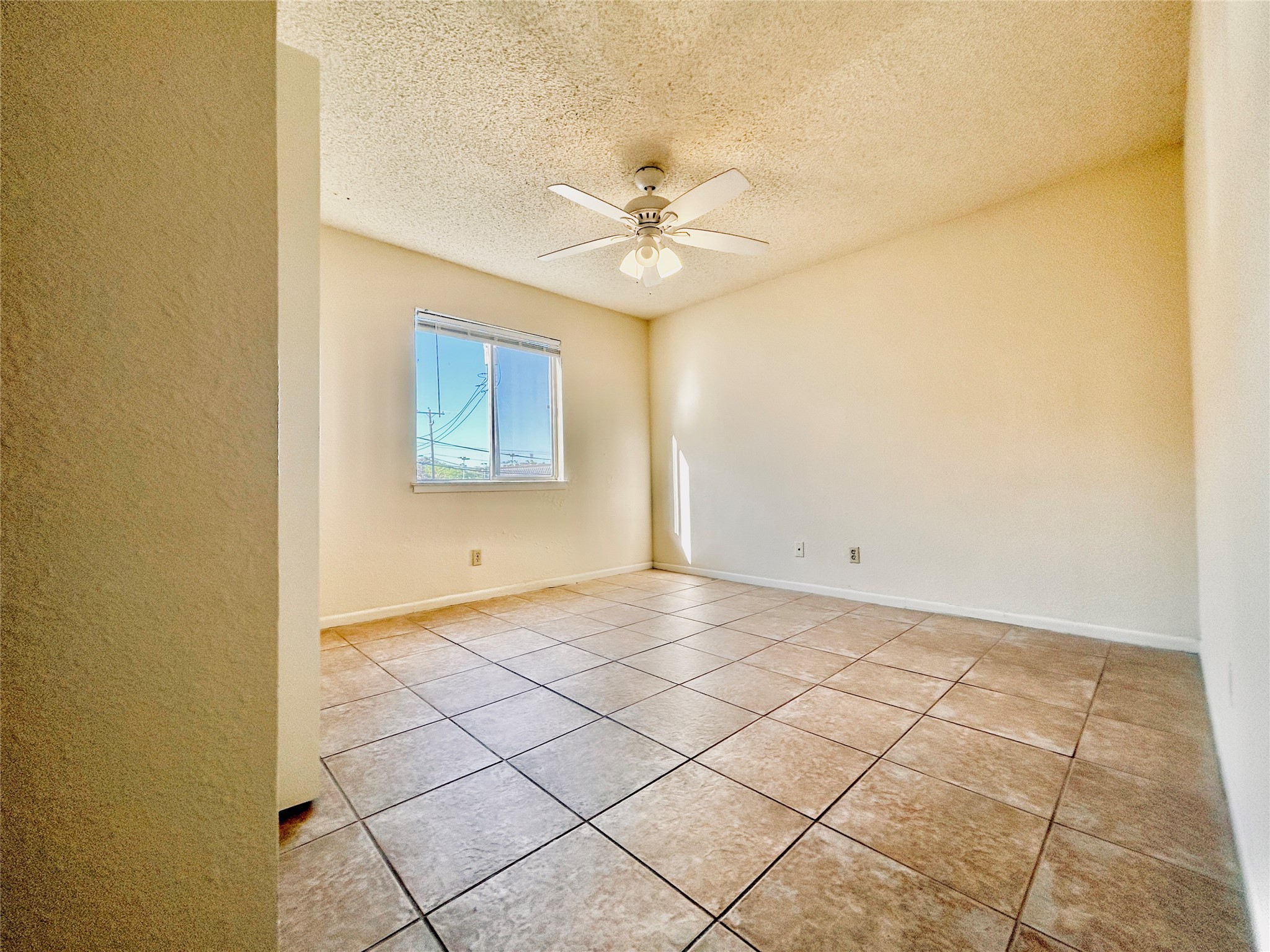 2408 Longview Street, Unit 110 Austin, TX 78705 - Photo 6 of 9 a view of a room with window and ceiling fan