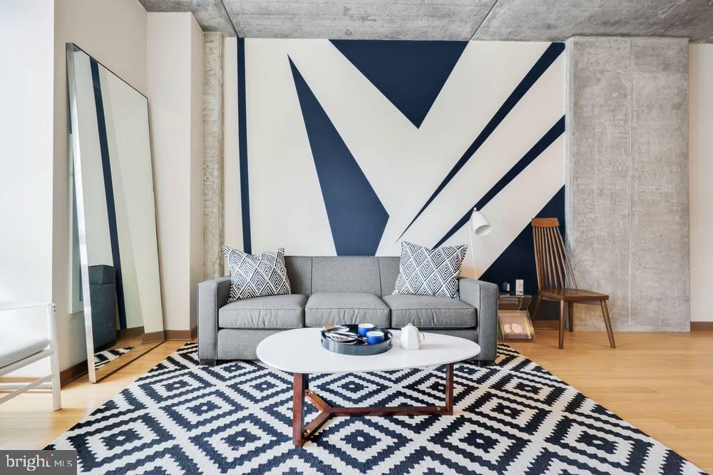 1901-39 Callowhill Street, Unit 320 Philadelphia, PA 19130 - Photo 14 of 17 a living room with furniture and a rug