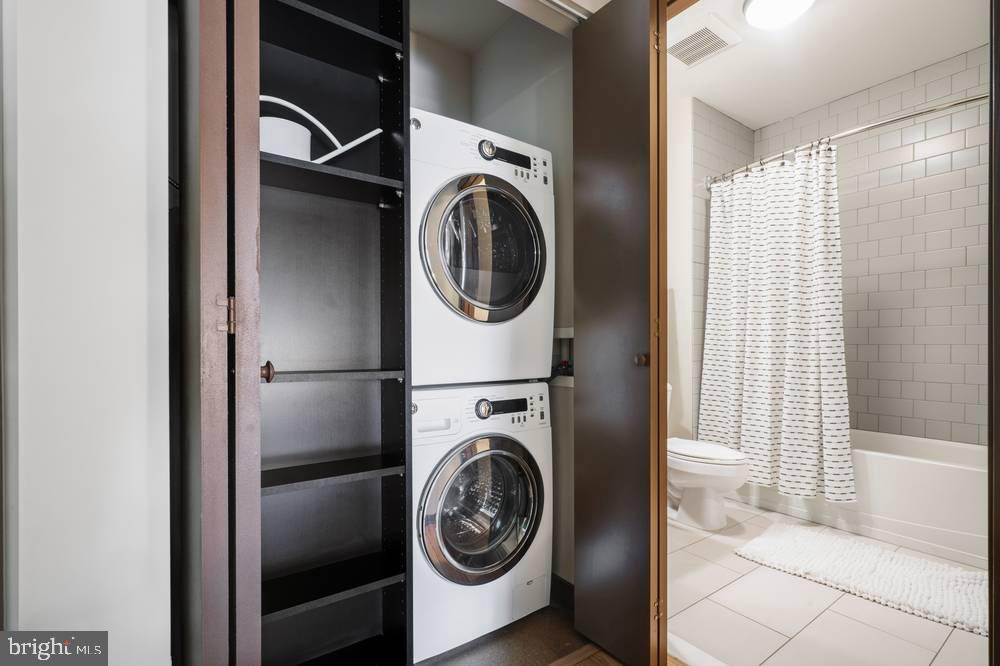 1901-39 Callowhill Street, Unit 320 Philadelphia, PA 19130 - Photo 10 of 17 a utility room with dryer and washer