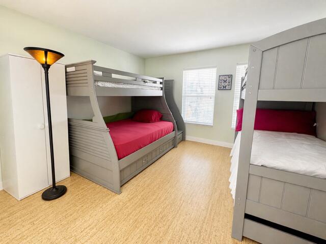 800 East Camino Real, Unit 416 Boca Raton, FL 33432 - Photo 12 of 18 a bedroom with a bed and a dresser