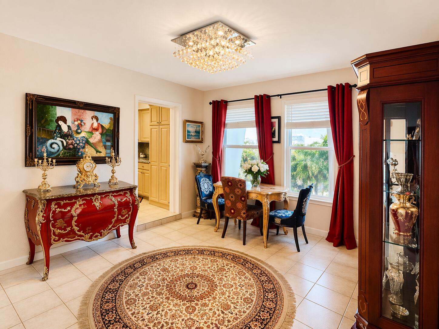 800 East Camino Real, Unit 416 Boca Raton, FL 33432 - Photo 6 of 18 a dining room with furniture a rug a rug and a painting