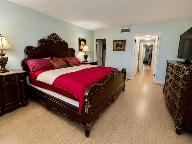 800 East Camino Real, Unit 416 Boca Raton, FL 33432 - Photo 8 of 18 a bed room with a bed and a television