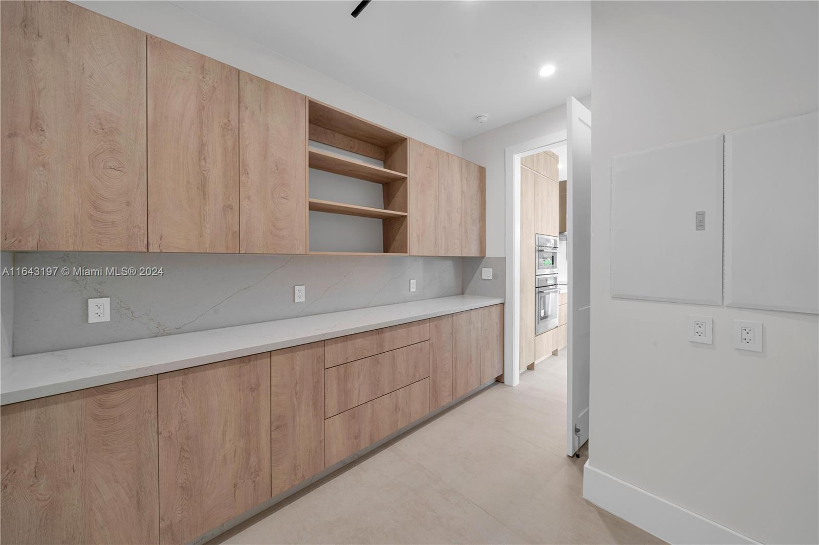 8821 Southwest 56th Street Miami, FL 33165 - Photo 11 of 49 a kitchen with stainless steel appliances a refrigerator and cabinets