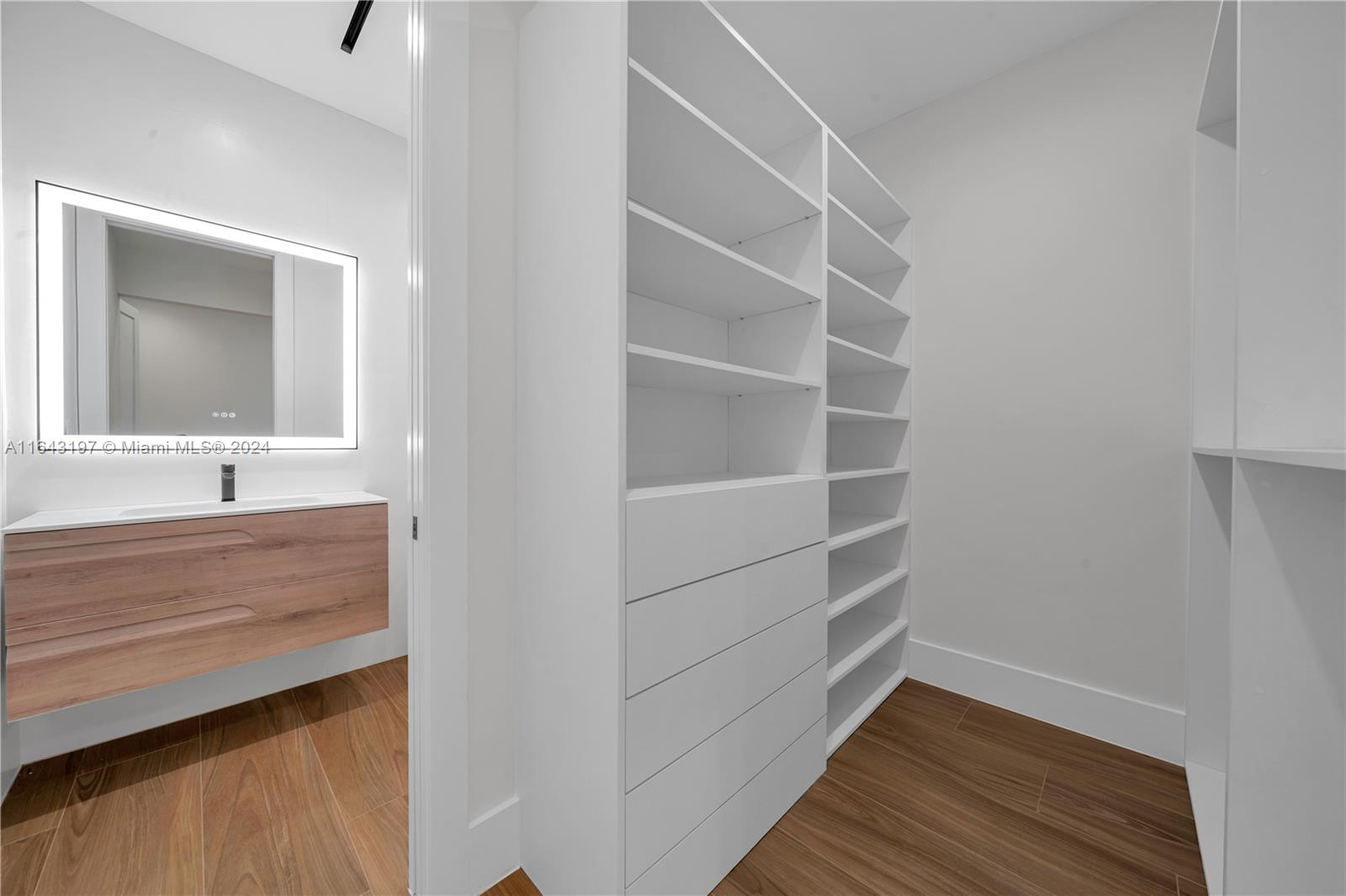 8821 Southwest 56th Street Miami, FL 33165 - Photo 25 of 49 a bathroom with a sink and a mirror