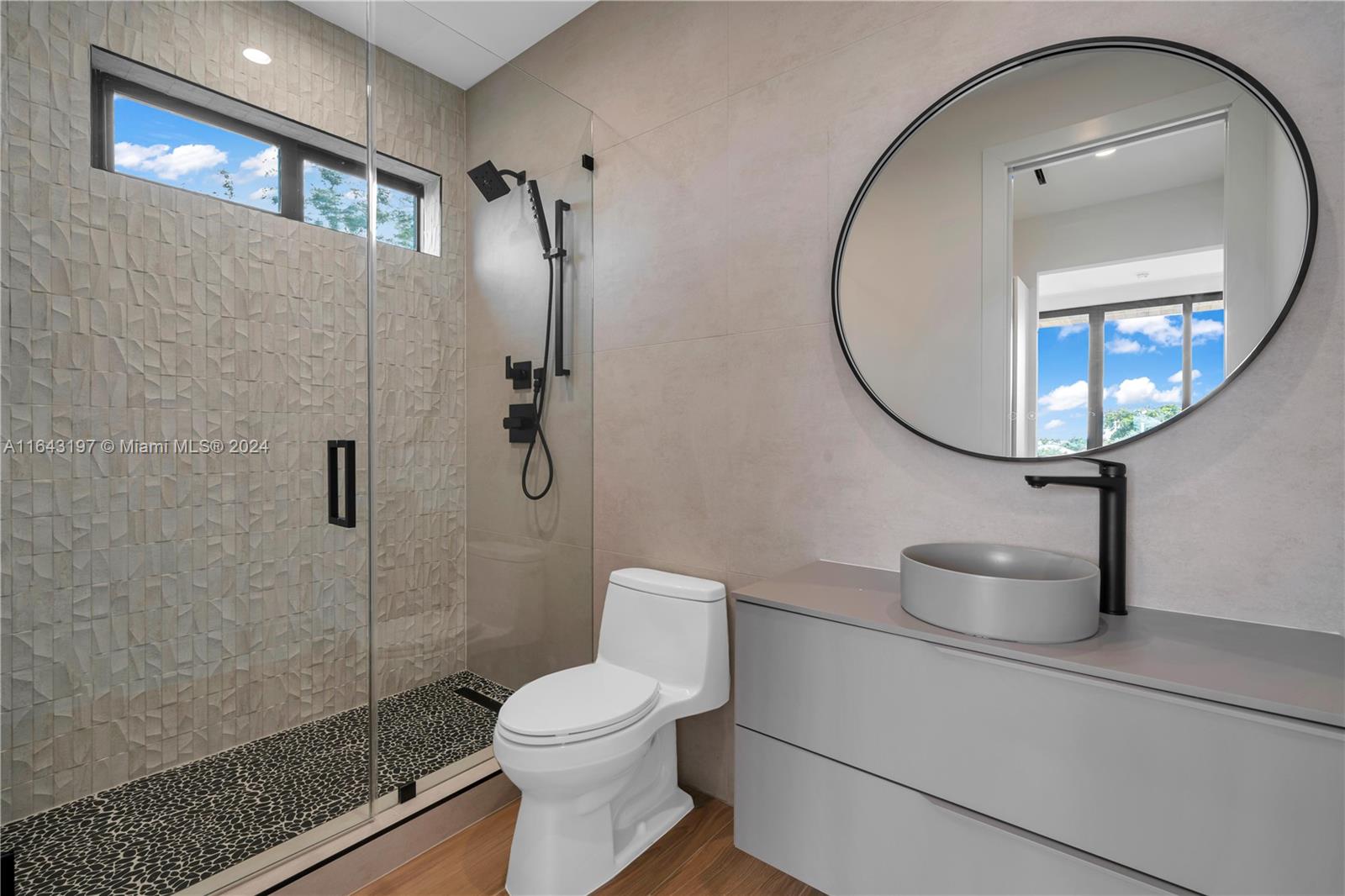 8821 Southwest 56th Street Miami, FL 33165 - Photo 28 of 49 a bathroom with a toilet a sink and a mirror