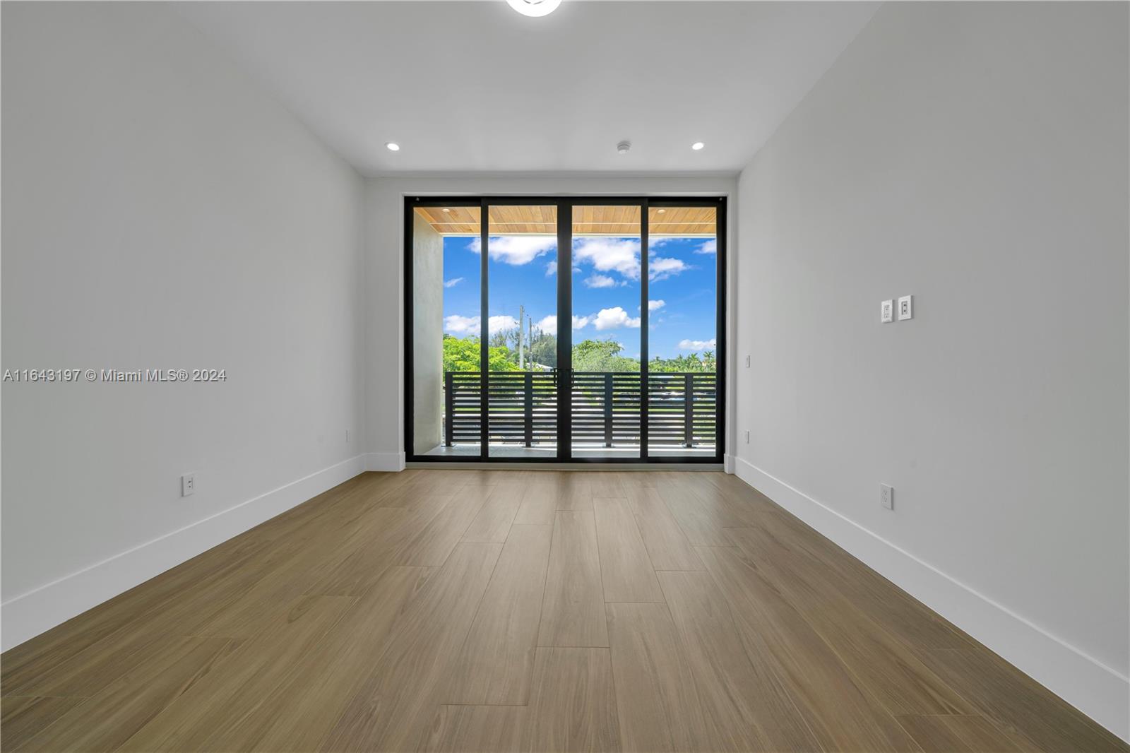 8821 Southwest 56th Street Miami, FL 33165 - Photo 29 of 49 wooden floor in an empty room with a window