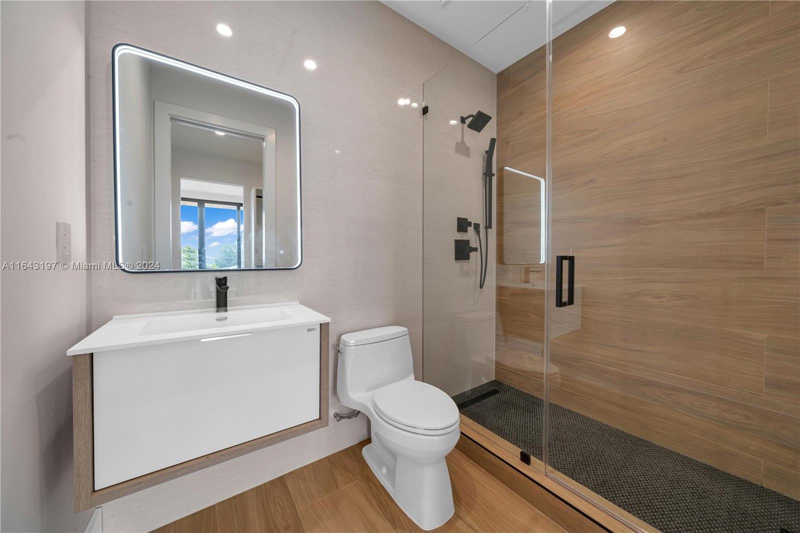 8821 Southwest 56th Street Miami, FL 33165 - Photo 31 of 49 a bathroom with a sink toilet and shower