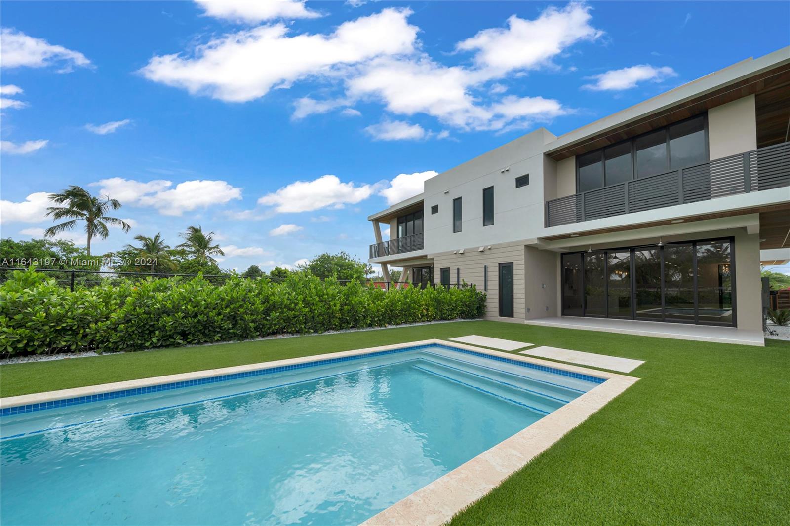 8821 Southwest 56th Street Miami, FL 33165 - Photo 41 of 49 a view of a swimming pool with an outdoor seating