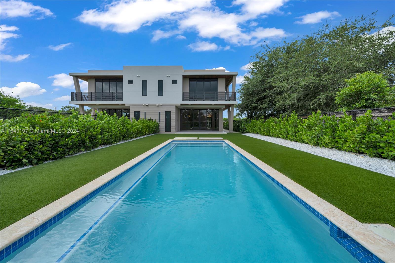 8821 Southwest 56th Street Miami, FL 33165 - Photo 42 of 49 a view of an swimming pool with a yard