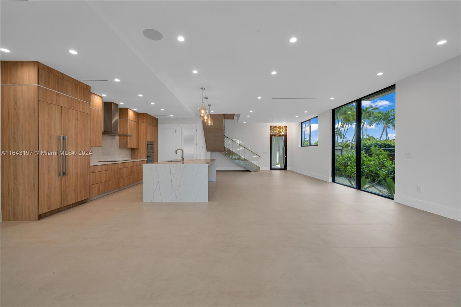 8821 Southwest 56th Street Miami, FL 33165 - Photo 5 of 49 a view of a kitchen with large windows and a living room