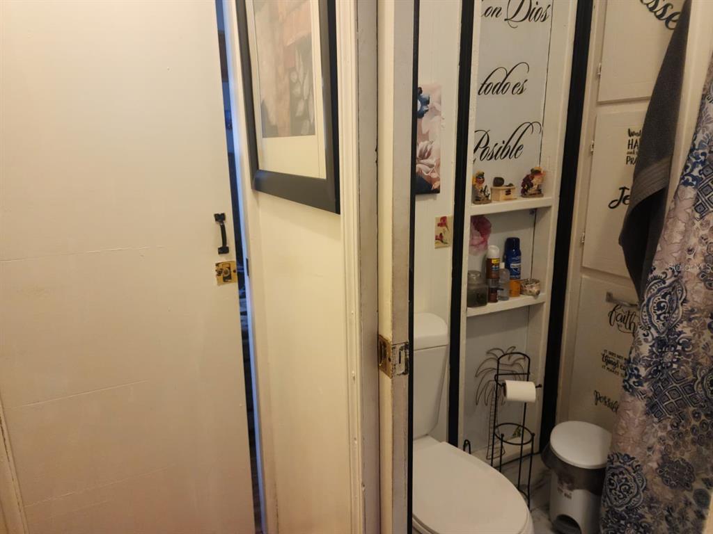 82 Silvio Road Lake Wales, FL 33898 - Photo 13 of 13 a bathroom with a toilet and a shower