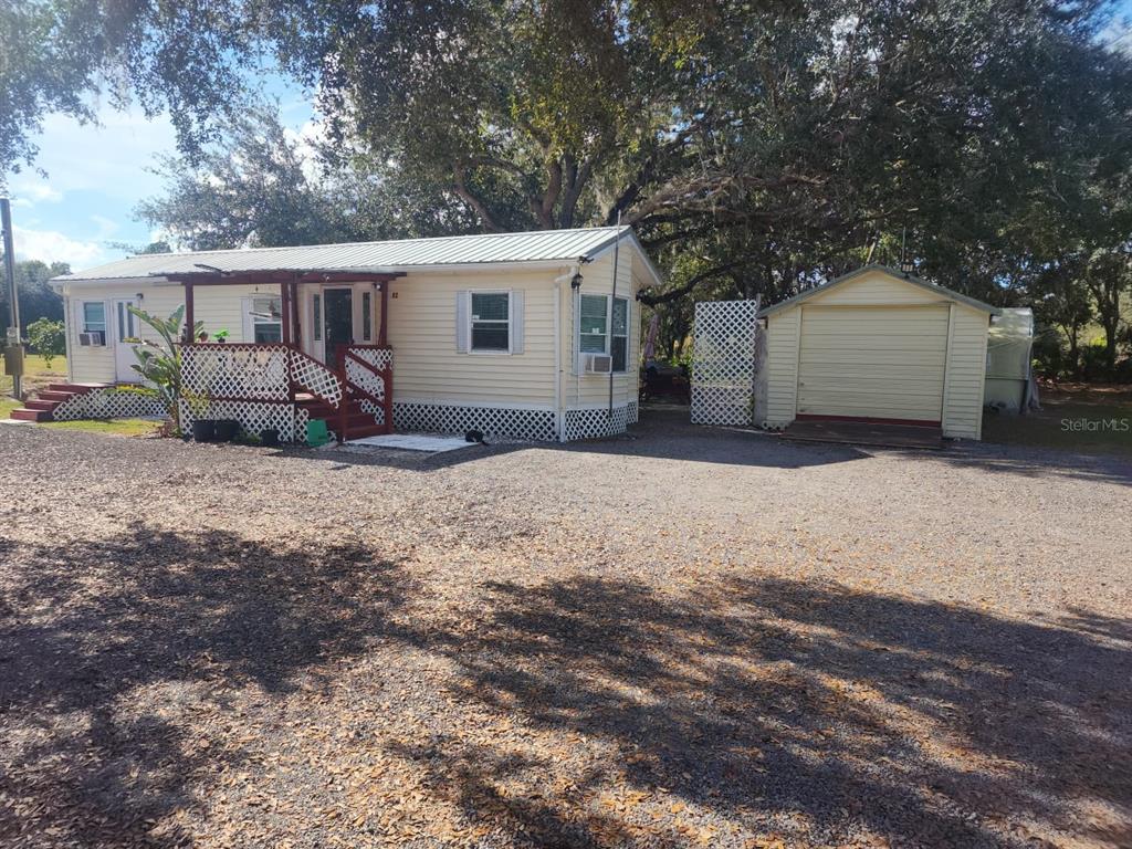 82 Silvio Road Lake Wales, FL 33898 - Photo 2 of 13 a view of a house with a outdoor space