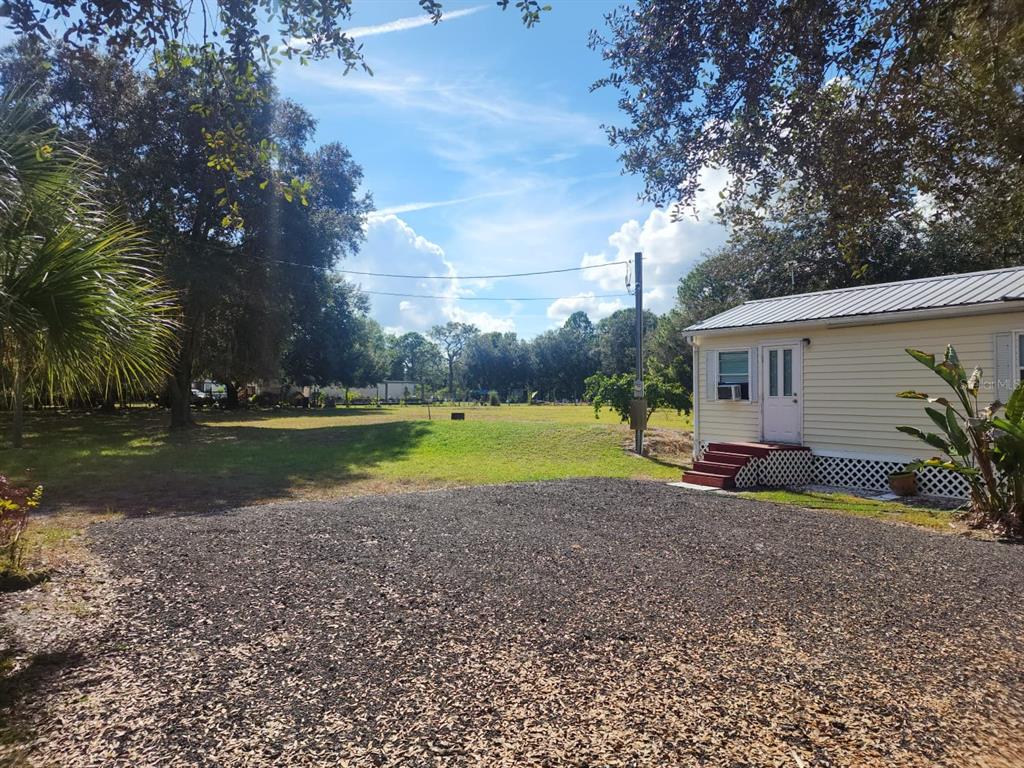 82 Silvio Road Lake Wales, FL 33898 - Photo 3 of 13 a view of a house with backyard and pool