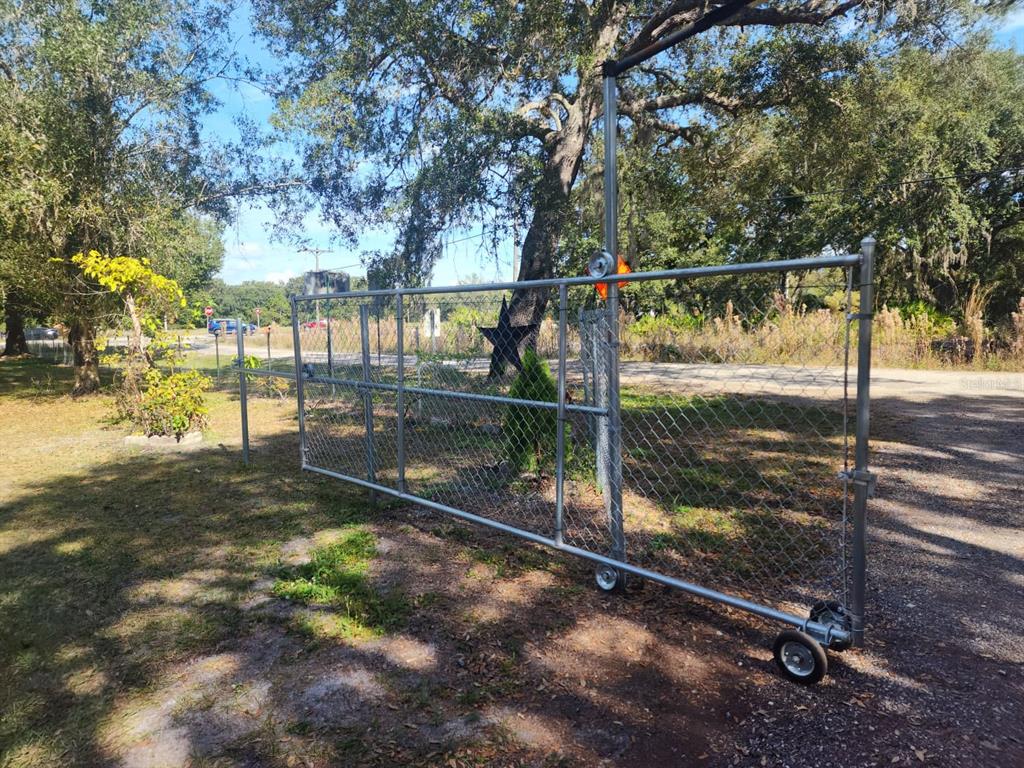 82 Silvio Road Lake Wales, FL 33898 - Photo 4 of 13 a view of a glass door with a yard