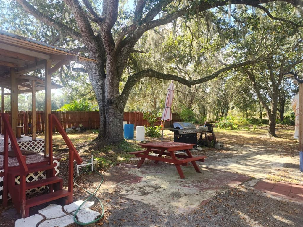 82 Silvio Road Lake Wales, FL 33898 - Photo 6 of 13 a view of a backyard with sitting area