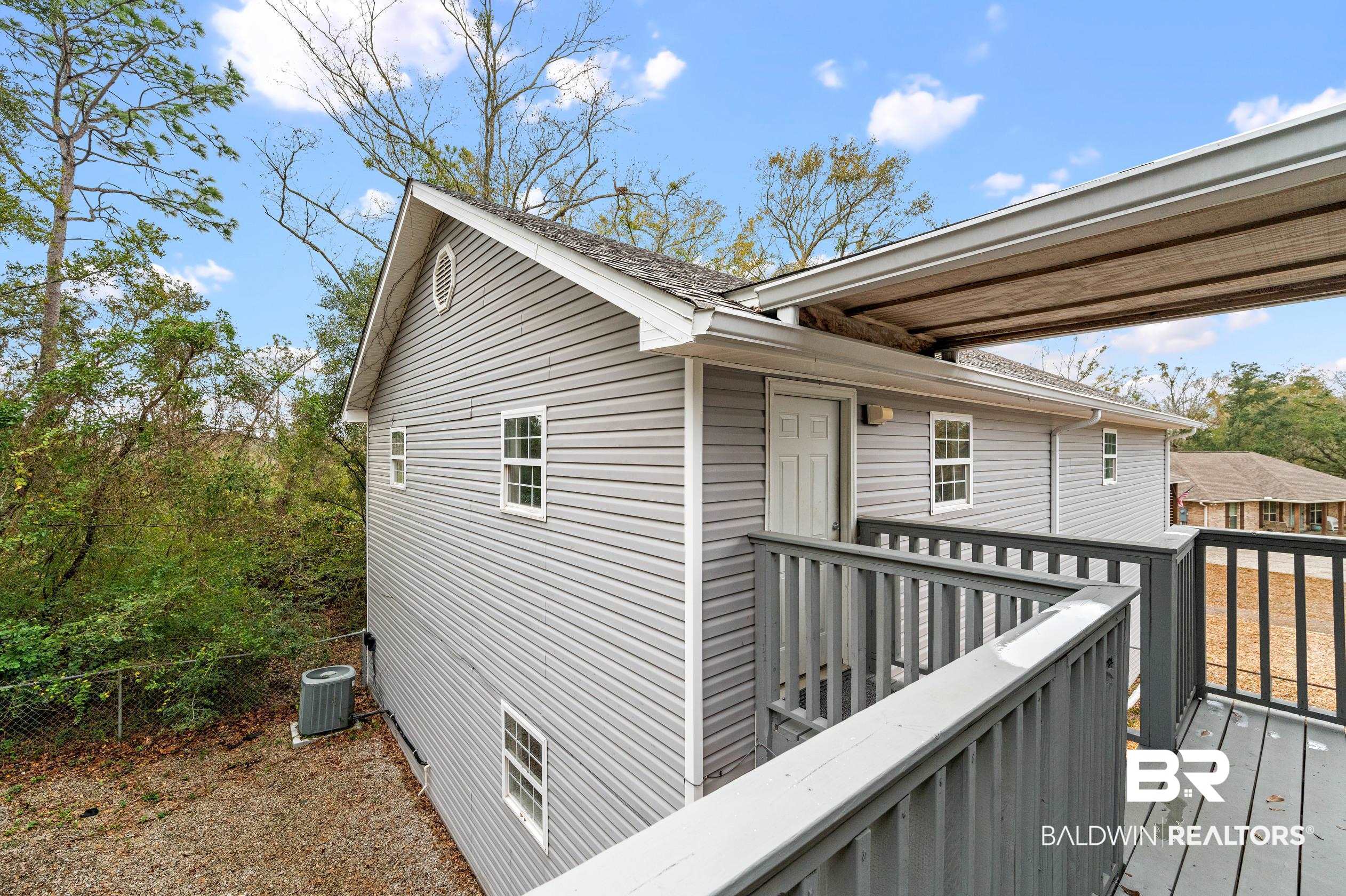 18786 Hillside Drive Foley, AL 36535 - Photo 37 of 49 Covered Wood Deck