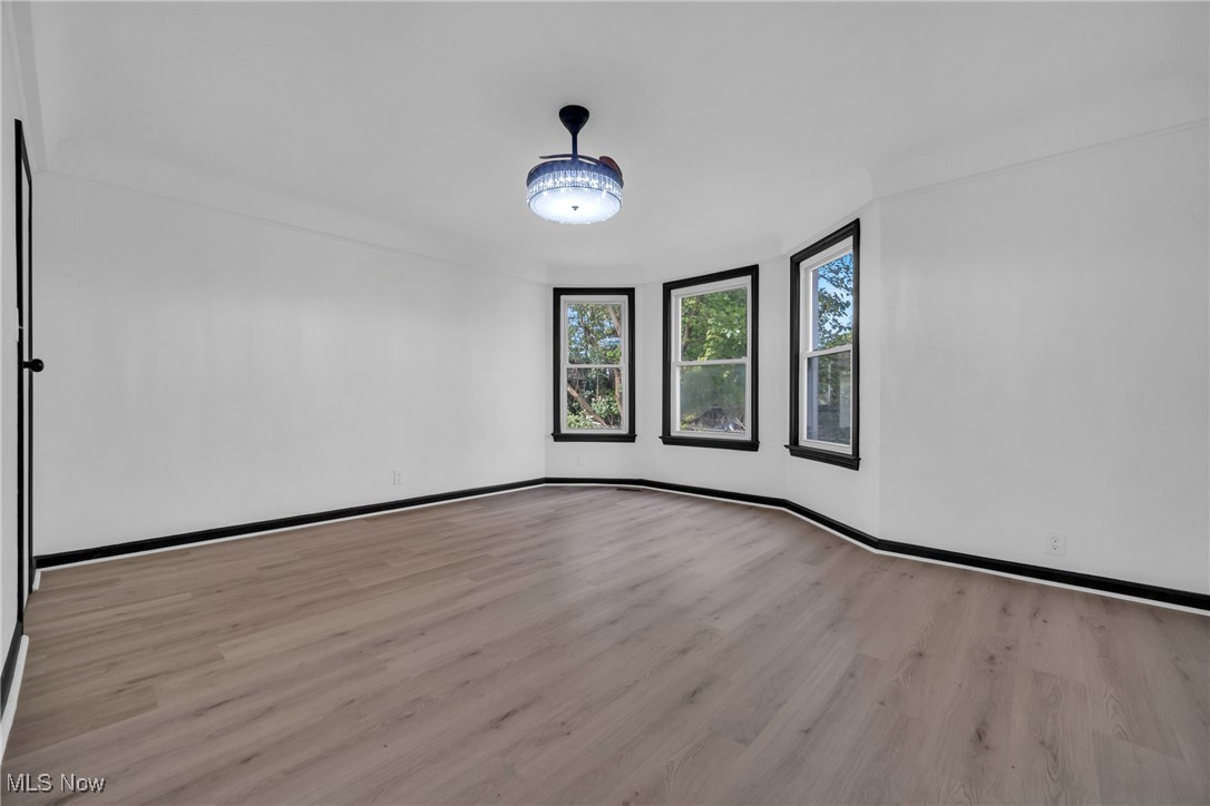 916 Nathaniel Road Cleveland, OH 44110 - Photo 10 of 28 Unfurnished room with light hardwood / wood-style flooring