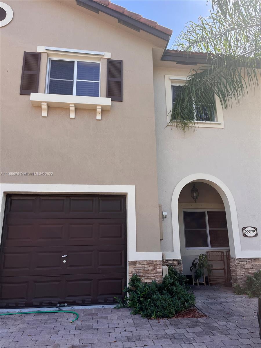 22025 Southwest 88th Path Cutler Bay, FL 33190 - Photo 1 of 34 a front view of a house with garden