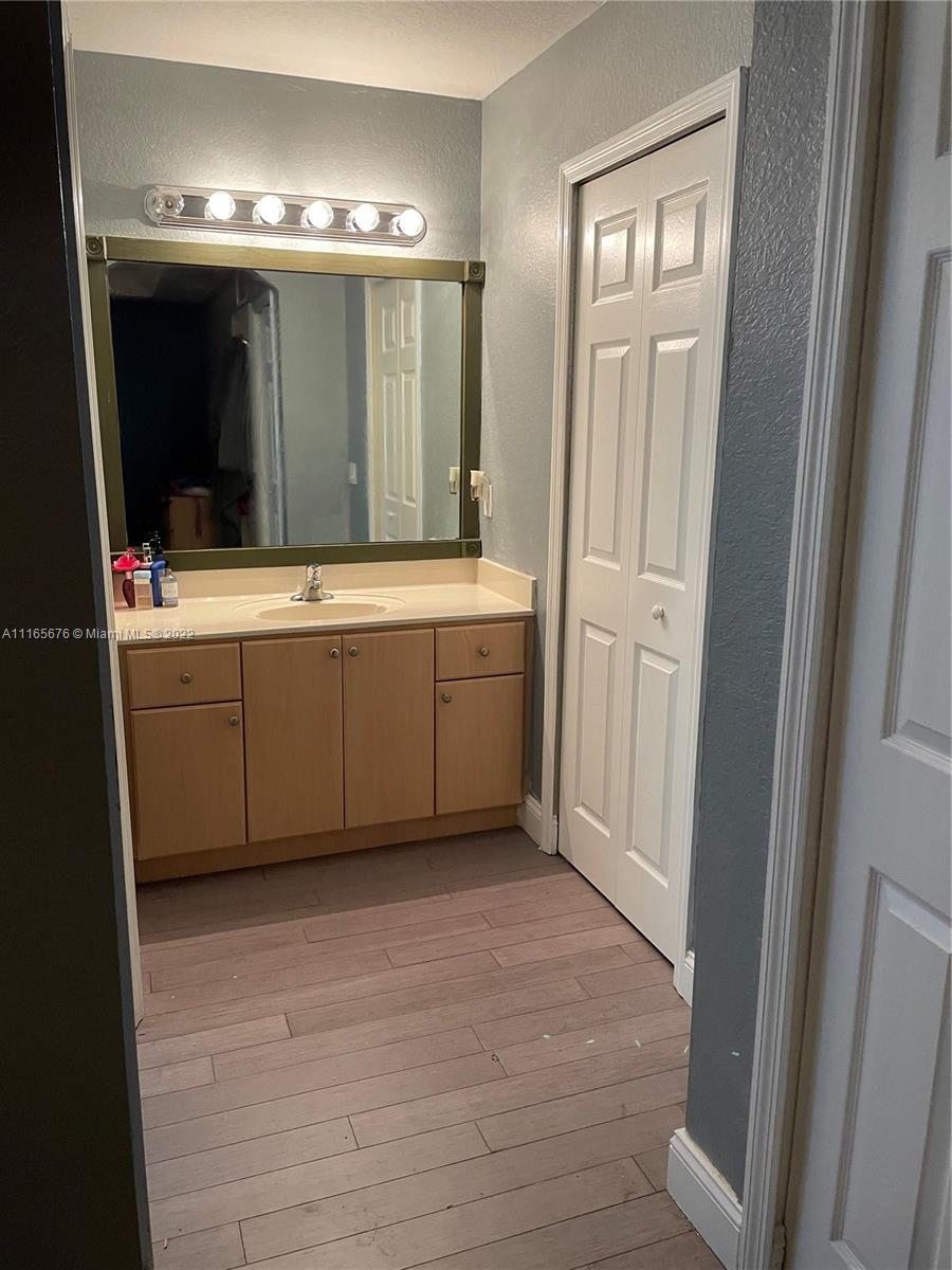 22025 Southwest 88th Path Cutler Bay, FL 33190 - Photo 21 of 34 a view of a bathroom with mirror and bathtub