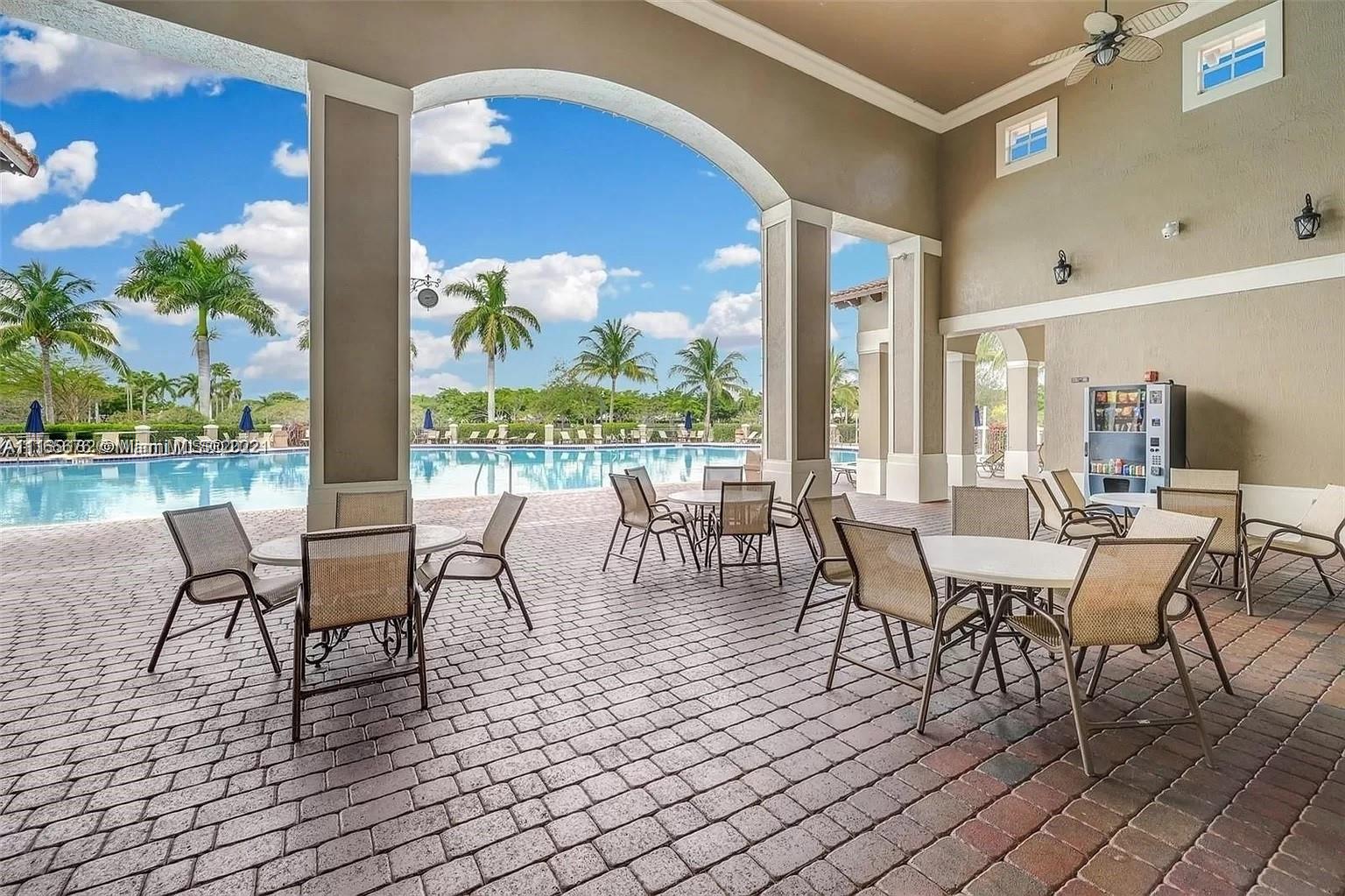 22025 Southwest 88th Path Cutler Bay, FL 33190 - Photo 30 of 34 a view of a dining room with furniture window and outside view
