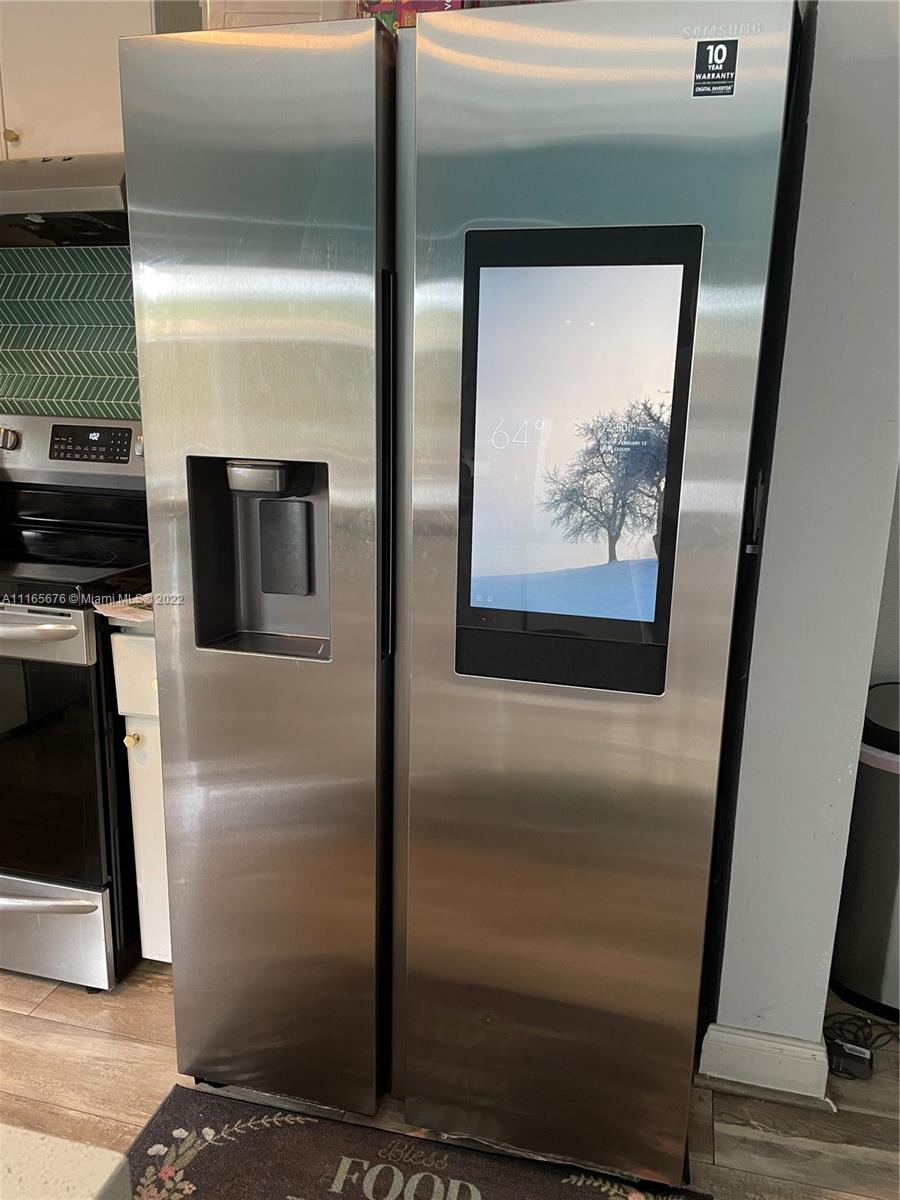 22025 Southwest 88th Path Cutler Bay, FL 33190 - Photo 5 of 34 a view of a refrigerator in kitchen
