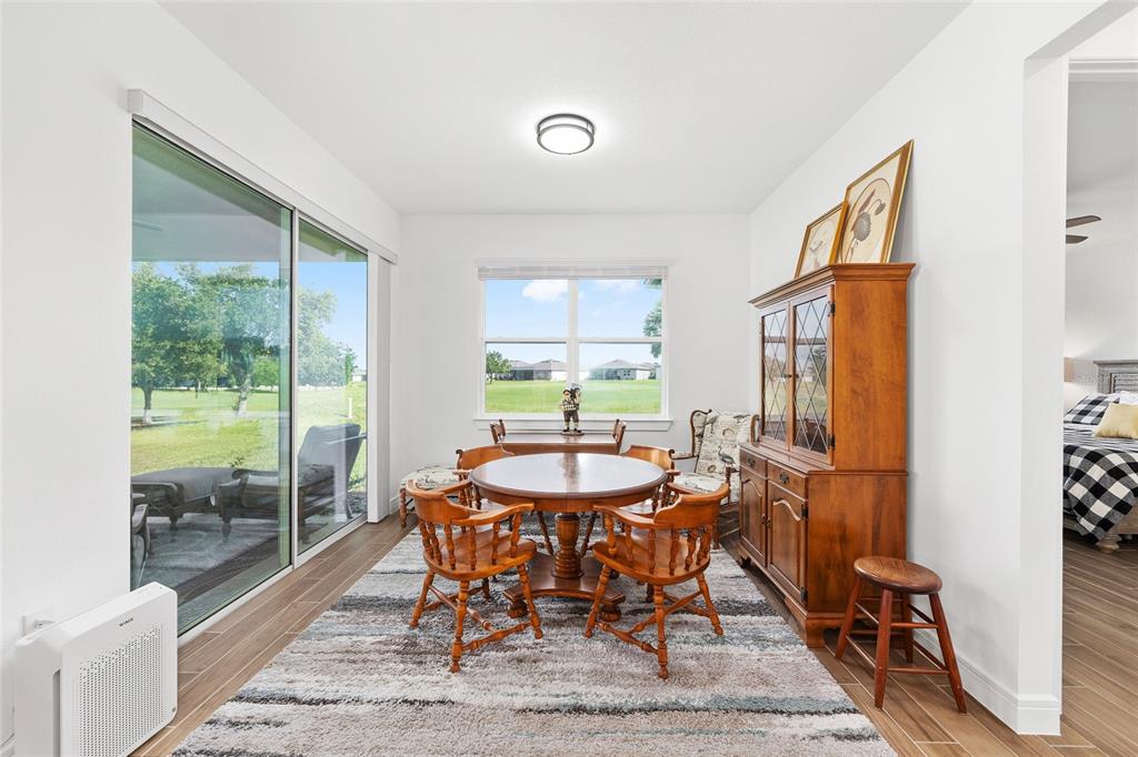 8989 Southwest 57th Pl Road Ocala, FL 34481 - Photo 17 of 47 a dining room with furniture and window