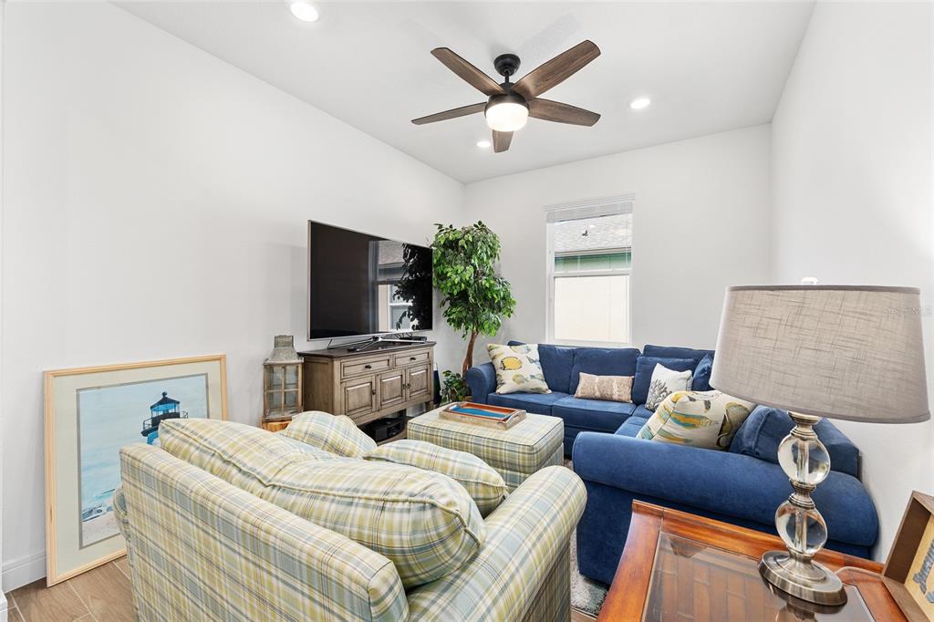 8989 Southwest 57th Pl Road Ocala, FL 34481 - Photo 20 of 47 a bedroom with furniture and a flat screen tv