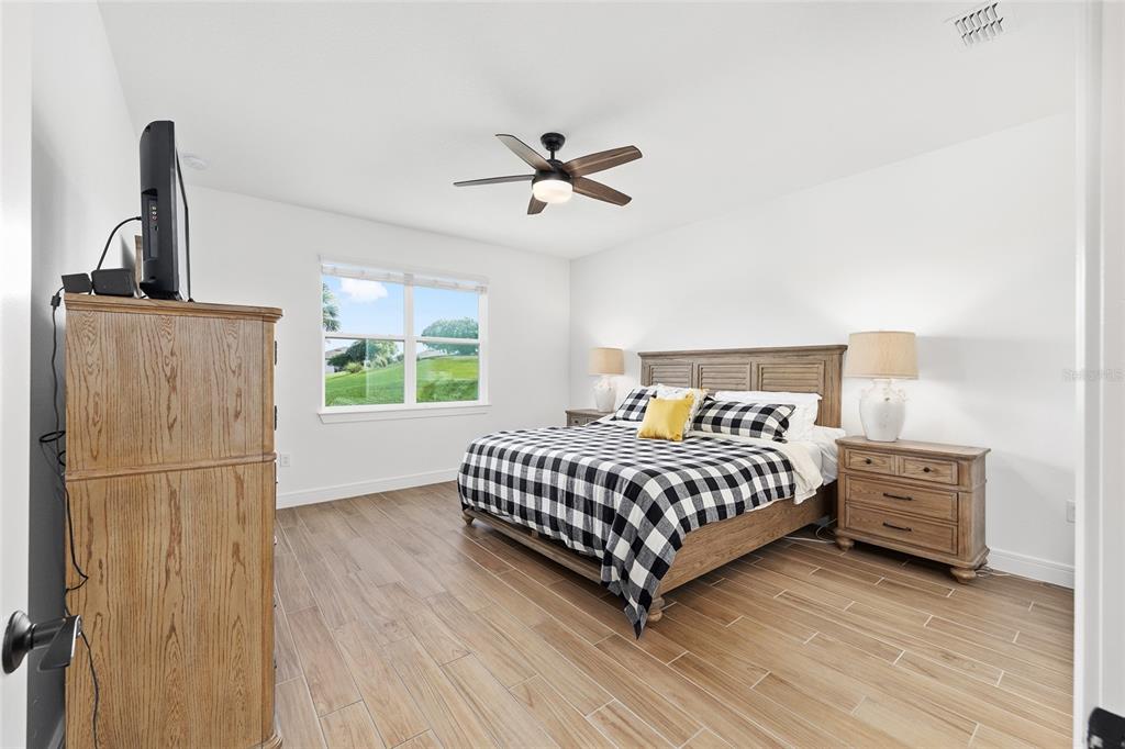 8989 Southwest 57th Pl Road Ocala, FL 34481 - Photo 21 of 47 a bedroom with a bed and a window