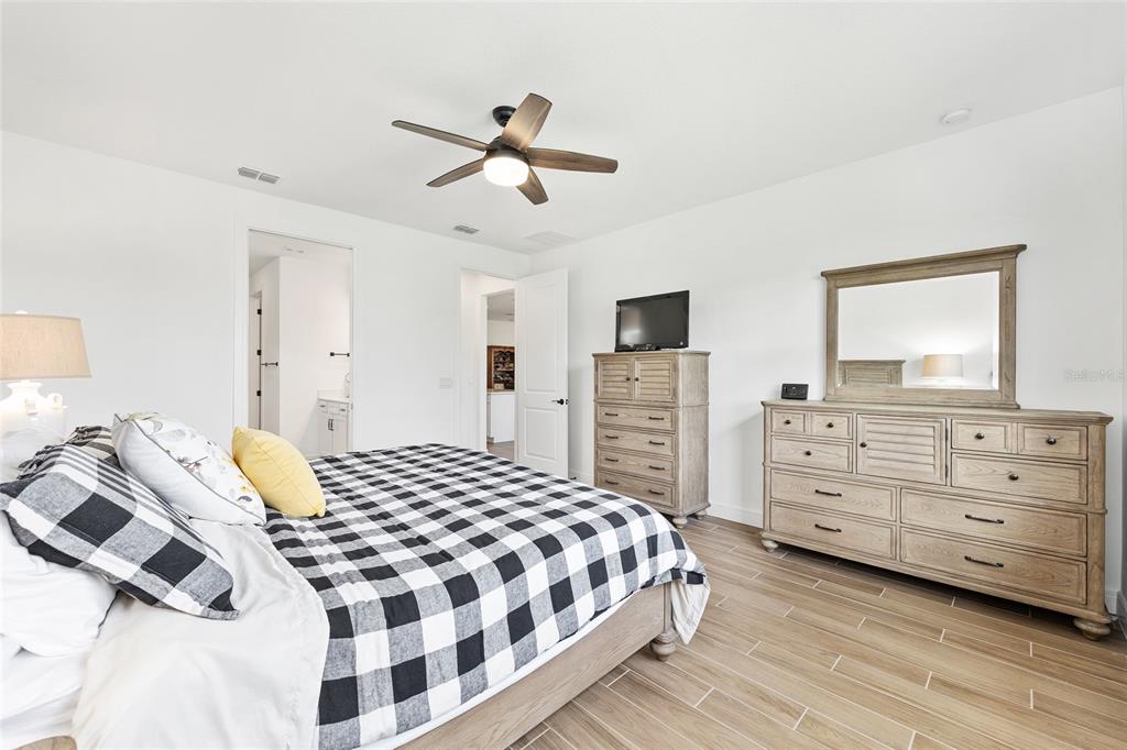 8989 Southwest 57th Pl Road Ocala, FL 34481 - Photo 23 of 47 a bedroom with a bed and a dresser